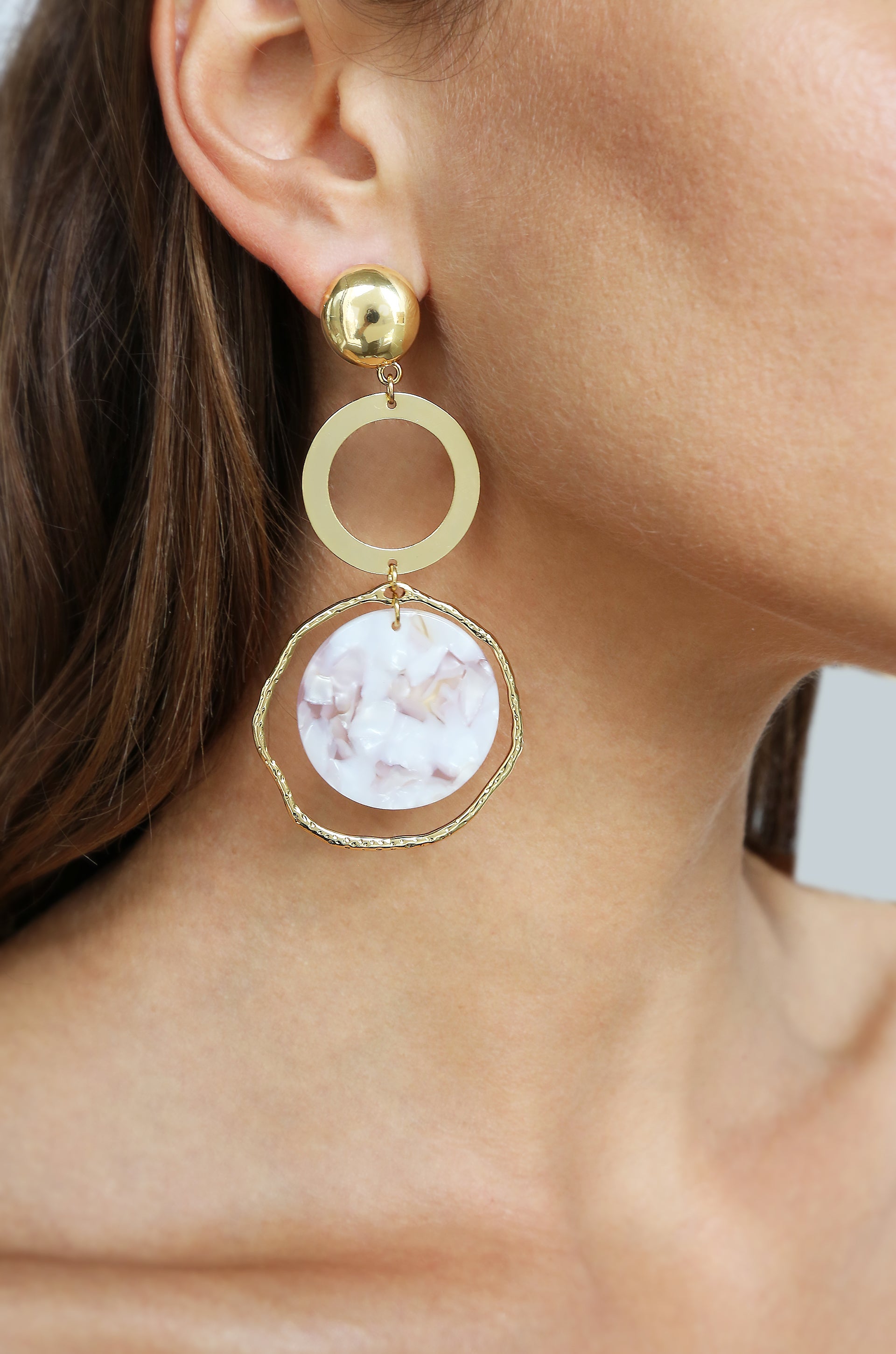 Inspired Blush Resin & 18k Gold Plated Dangle Earrings shown on a model  