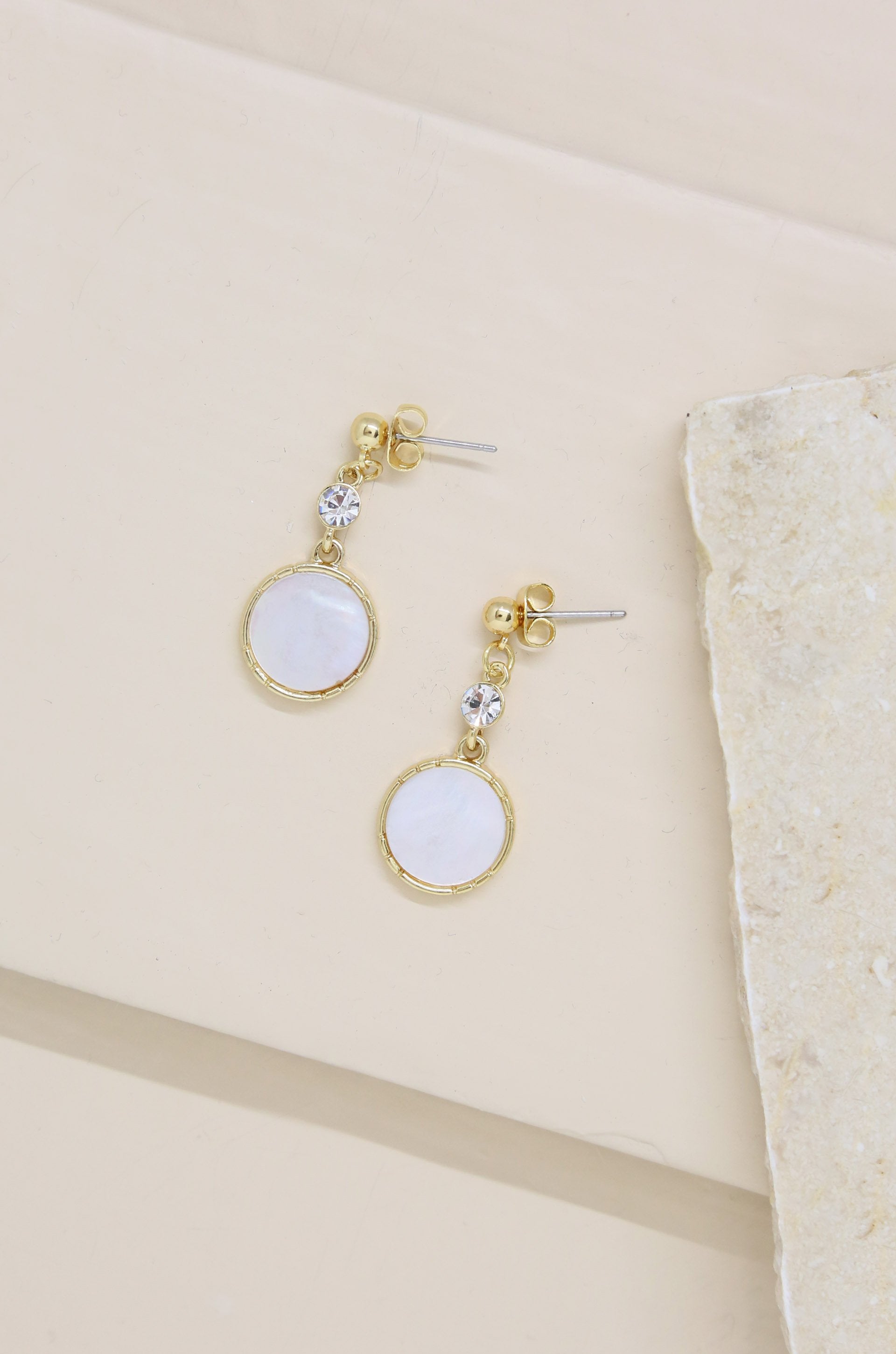 Love by the Moon White Drop 18k Gold Plated Earrings on slate background  