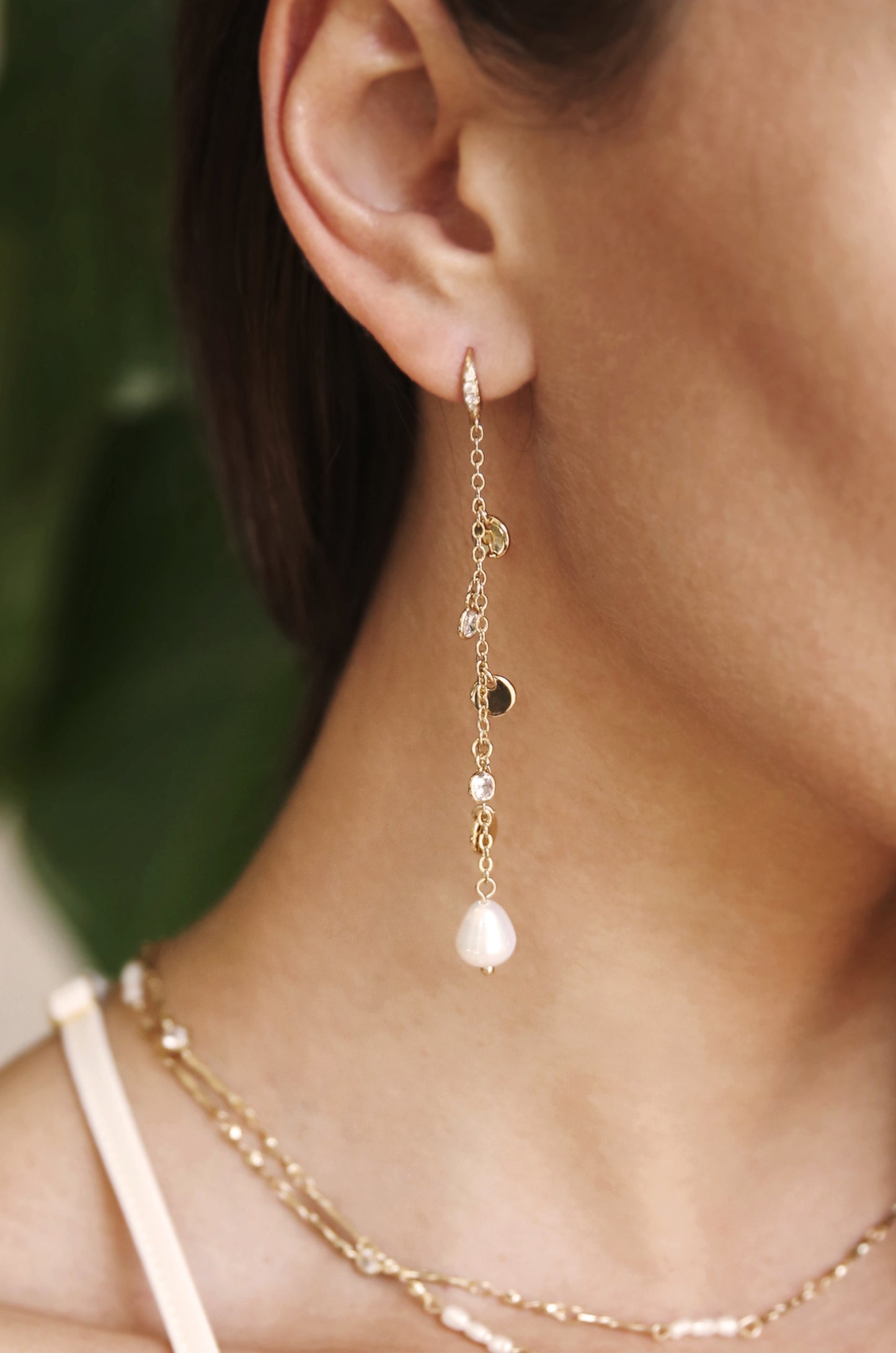 Delicate Dangle Freshwater Pearl 18k Gold Plated Earrings shown on a model  