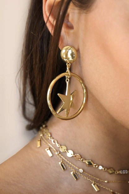 Dramatic Star Hoop 18k Gold Plated Earrings shown on a model  