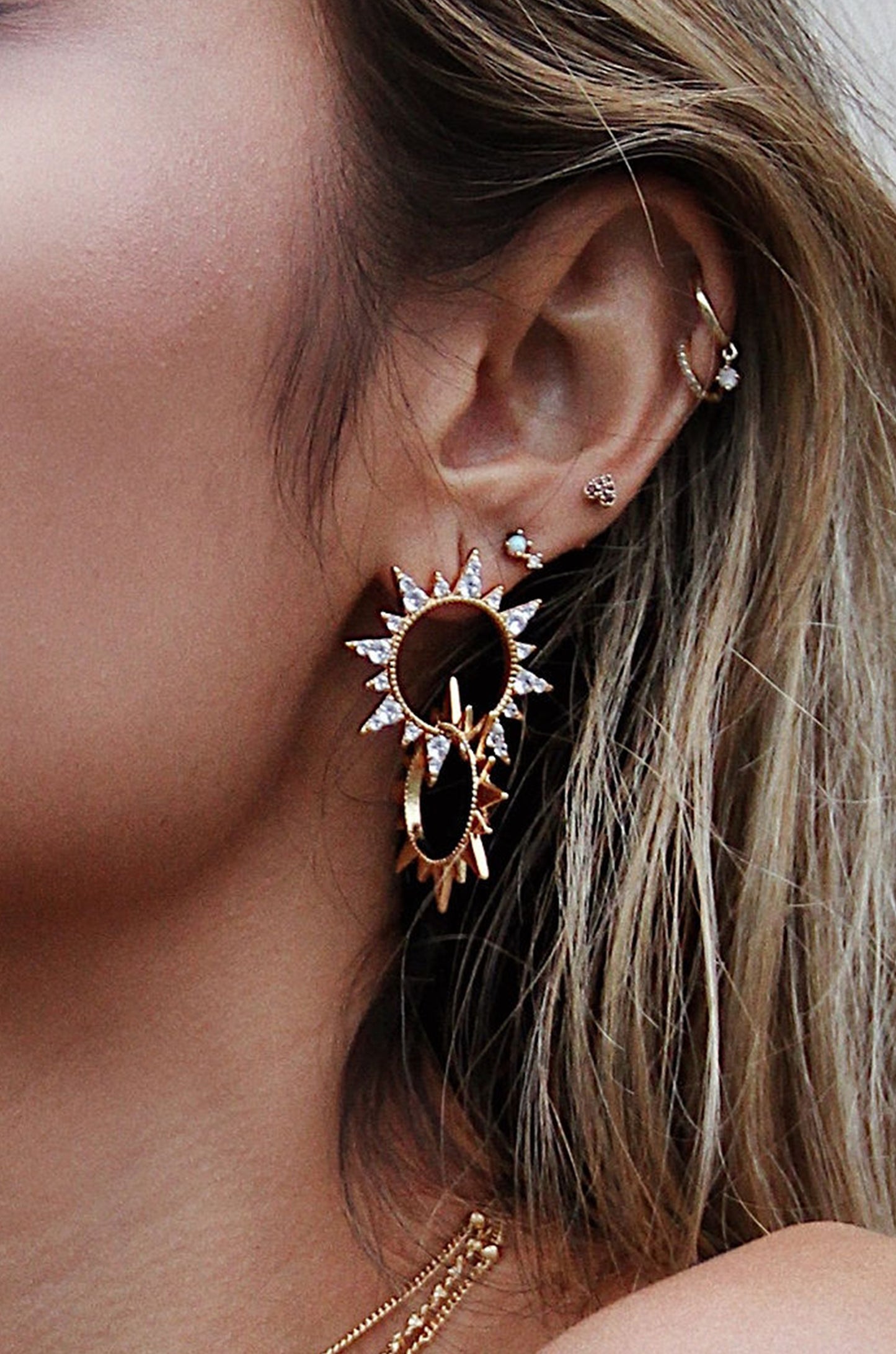 Crystal Golden Double Sun 18k Gold Plated Earrings shown on a model  