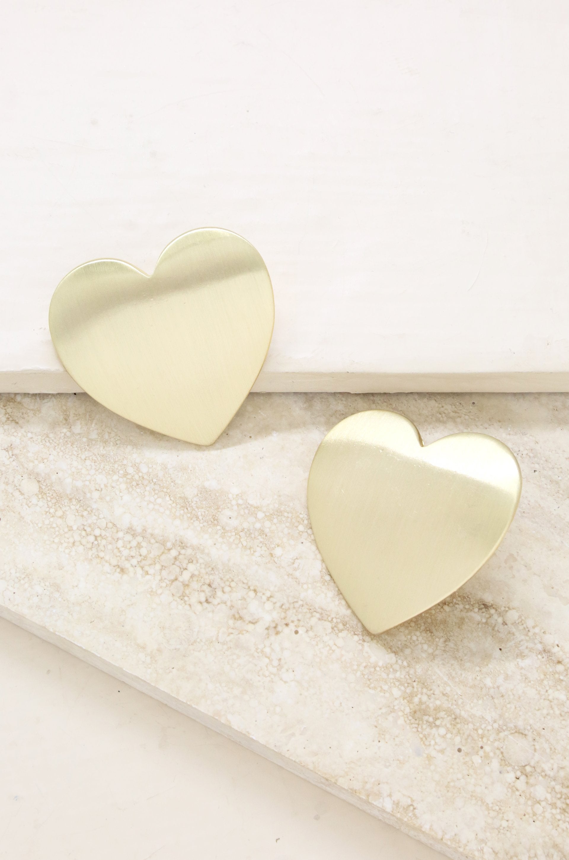 Flat Heart Statement 18k Gold Plated Stud Earrings on slate background  