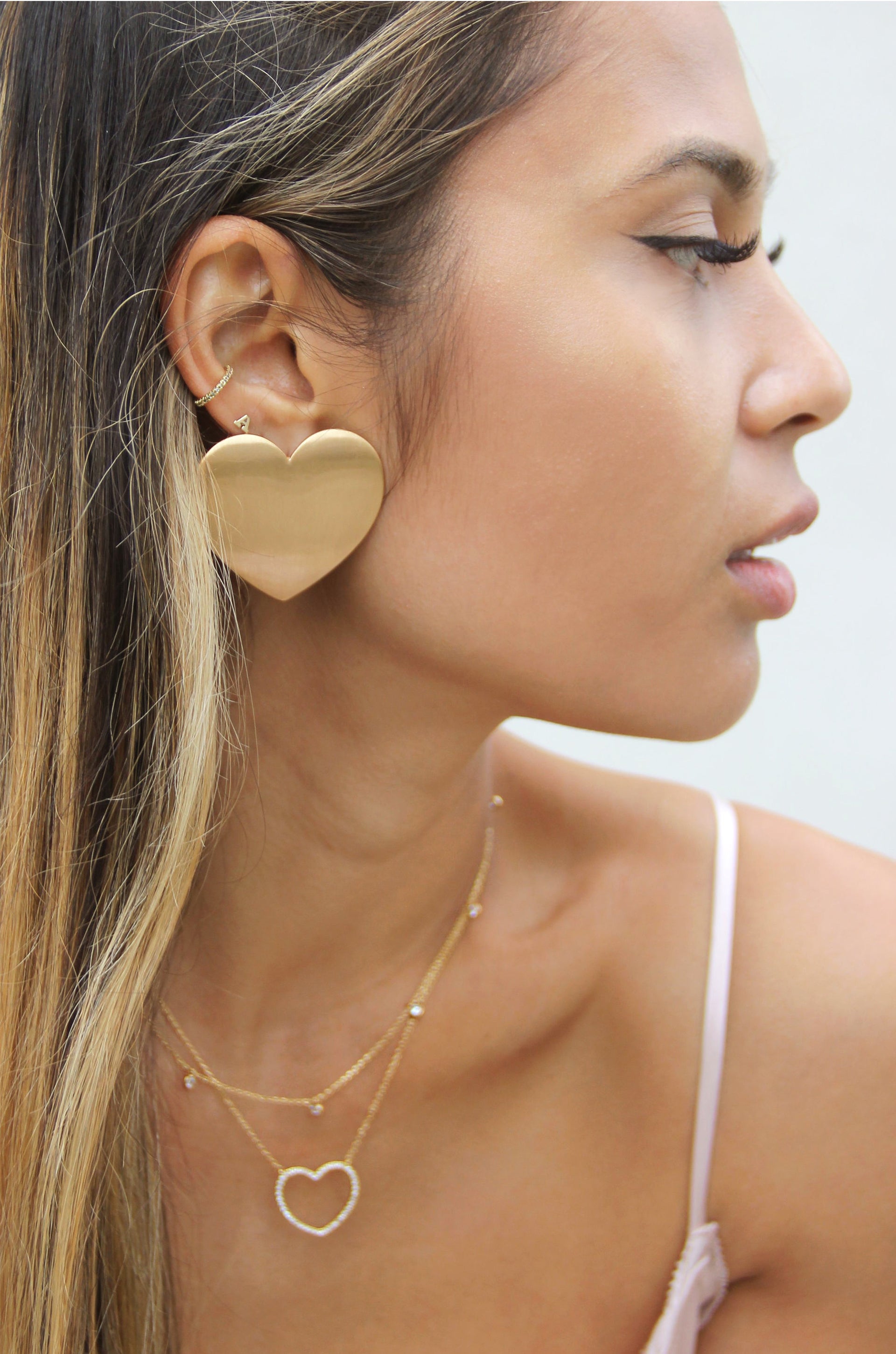 Flat Heart Statement 18k Gold Plated Stud Earrings shown on a model  