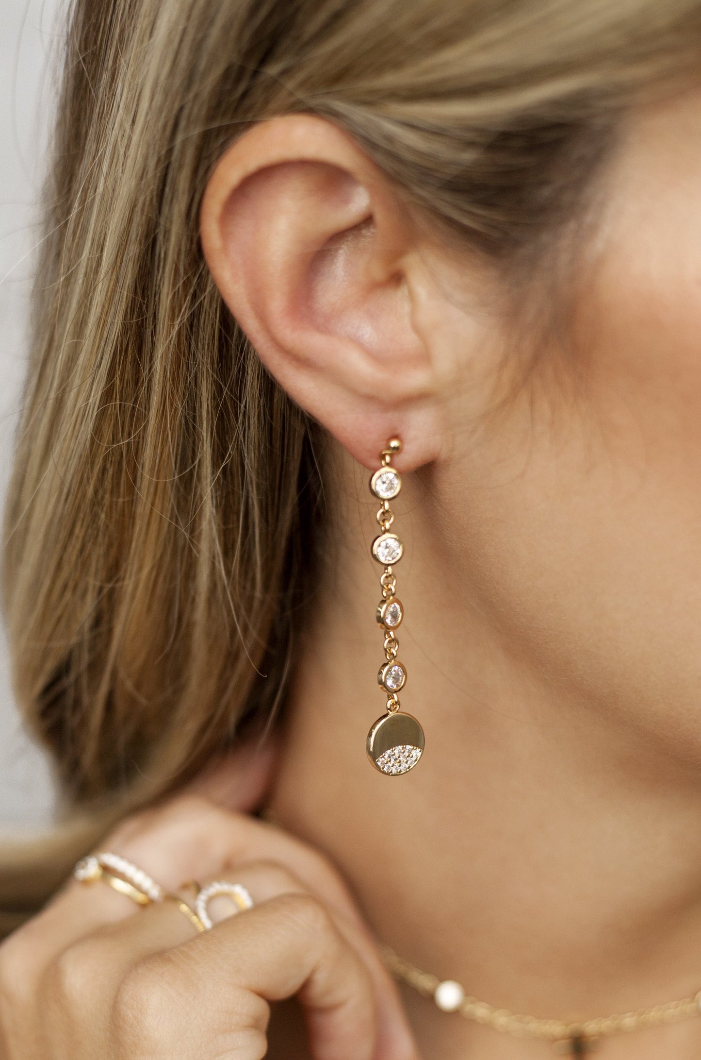 Dangle Dipped 18k Gold Plated and Crystal Earrings on a model