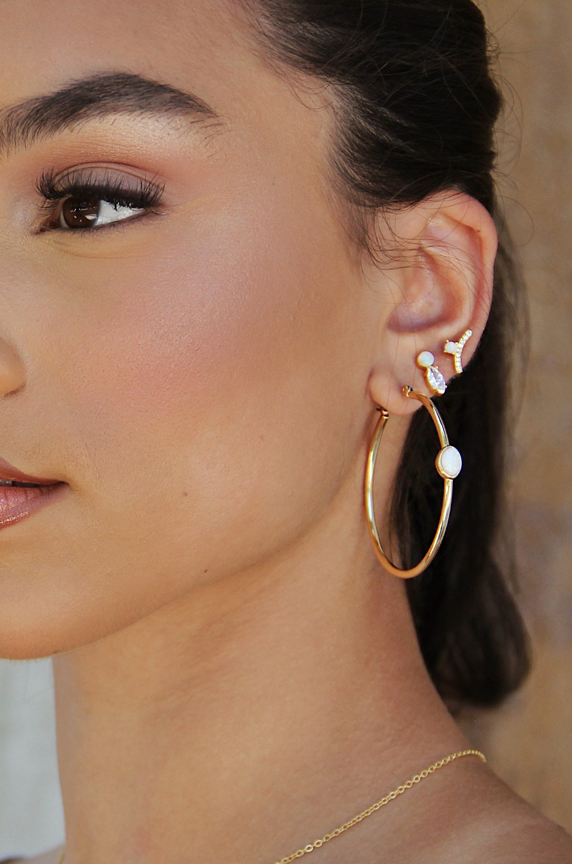 A Drop of Opal Hoop 18k Gold Plated Earrings shown on a model  