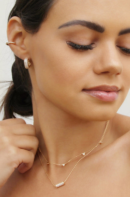 Little Reminders Crystal 18k Gold Plated Mini Hoop Earrings shown on a model  