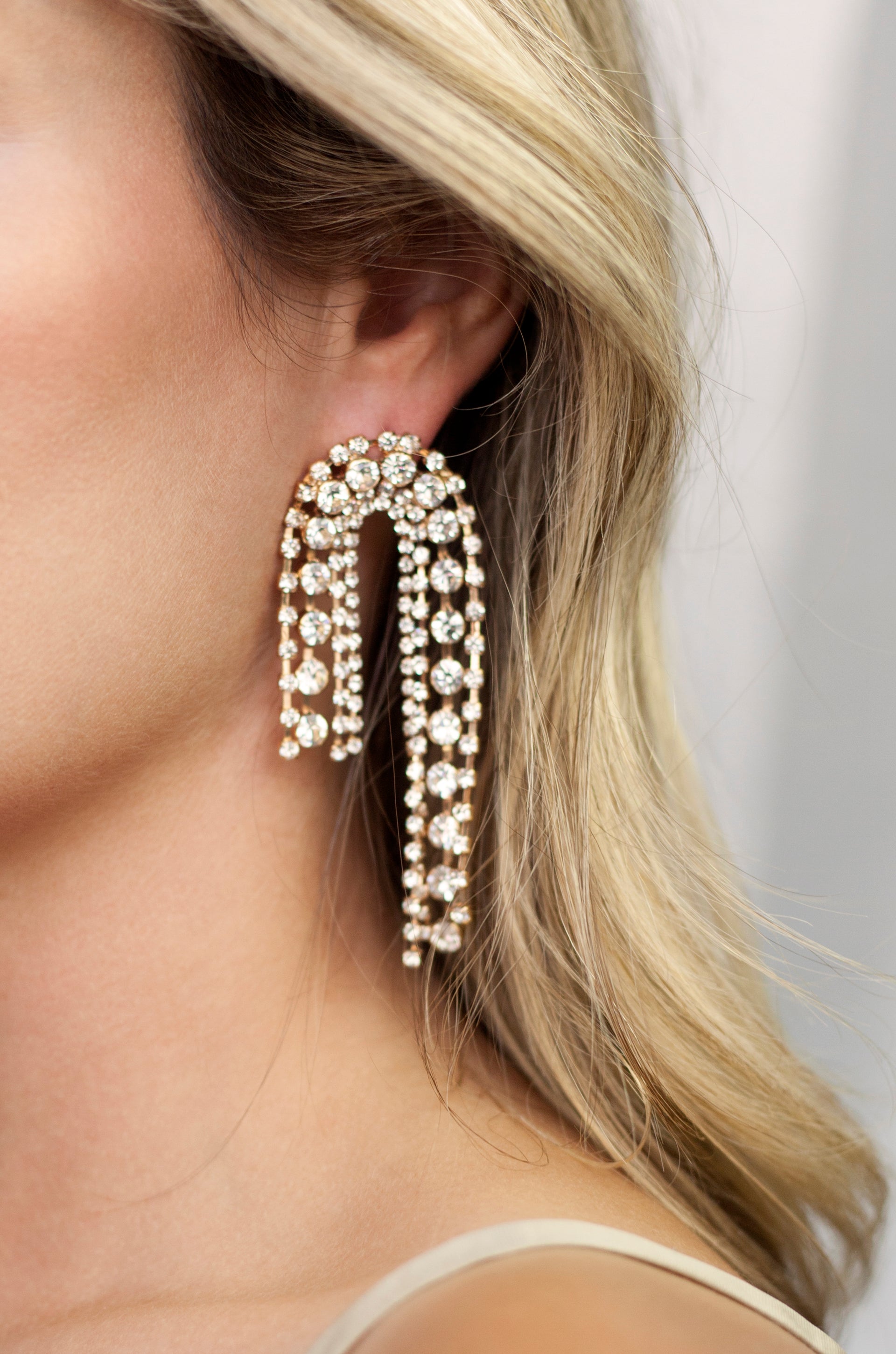 Crystal Arch Chain Statement Earrings on model