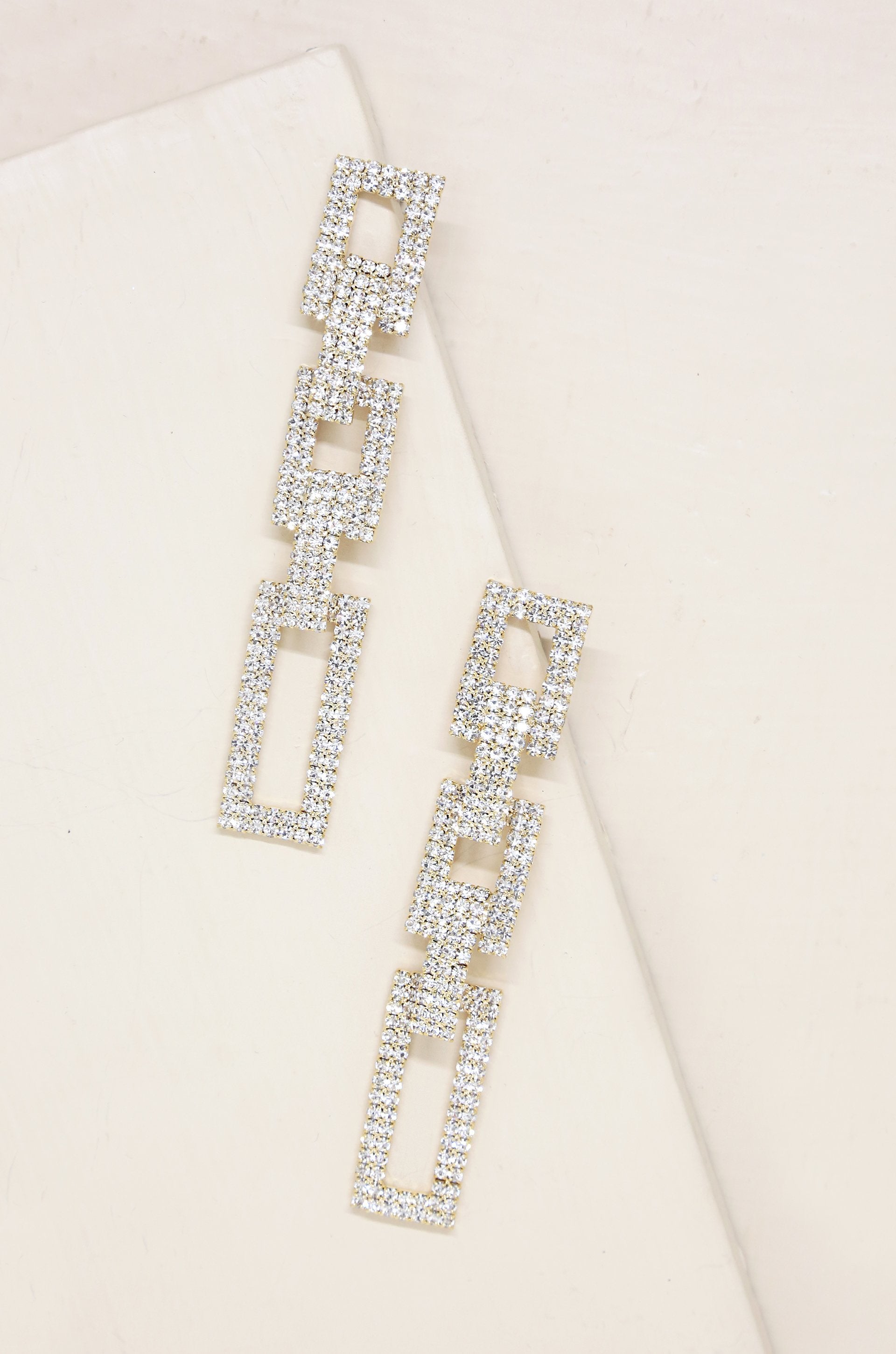 Crystal Rectangle Chain Link 18k Gold Plated Earrings on slate background  