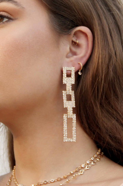 Crystal Rectangle Chain Link 18k Gold Plated Earrings shown on a model  