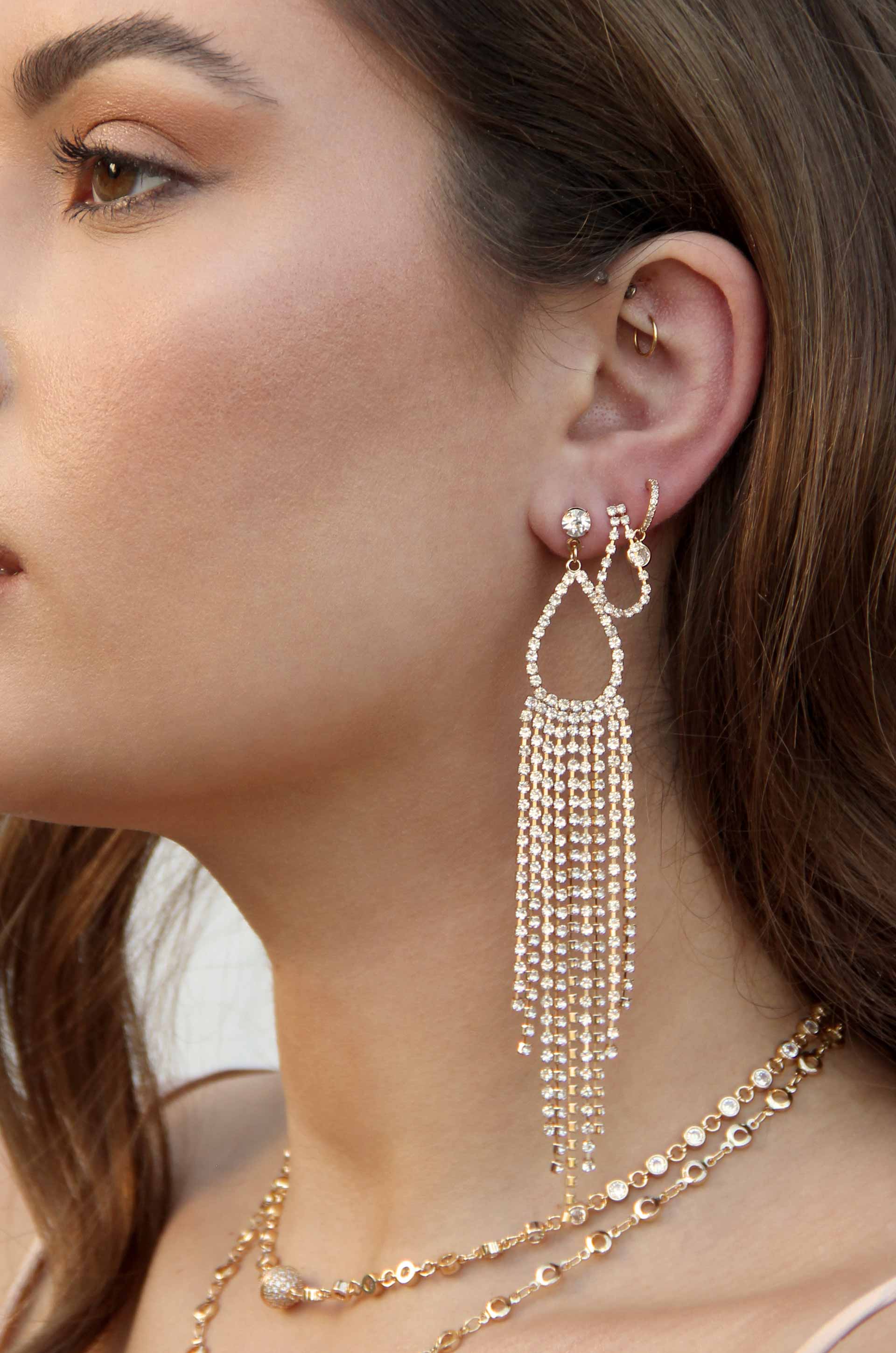 Long Teardrop Crystal Chandelier 18k Gold Plated Earrings shown on a model  