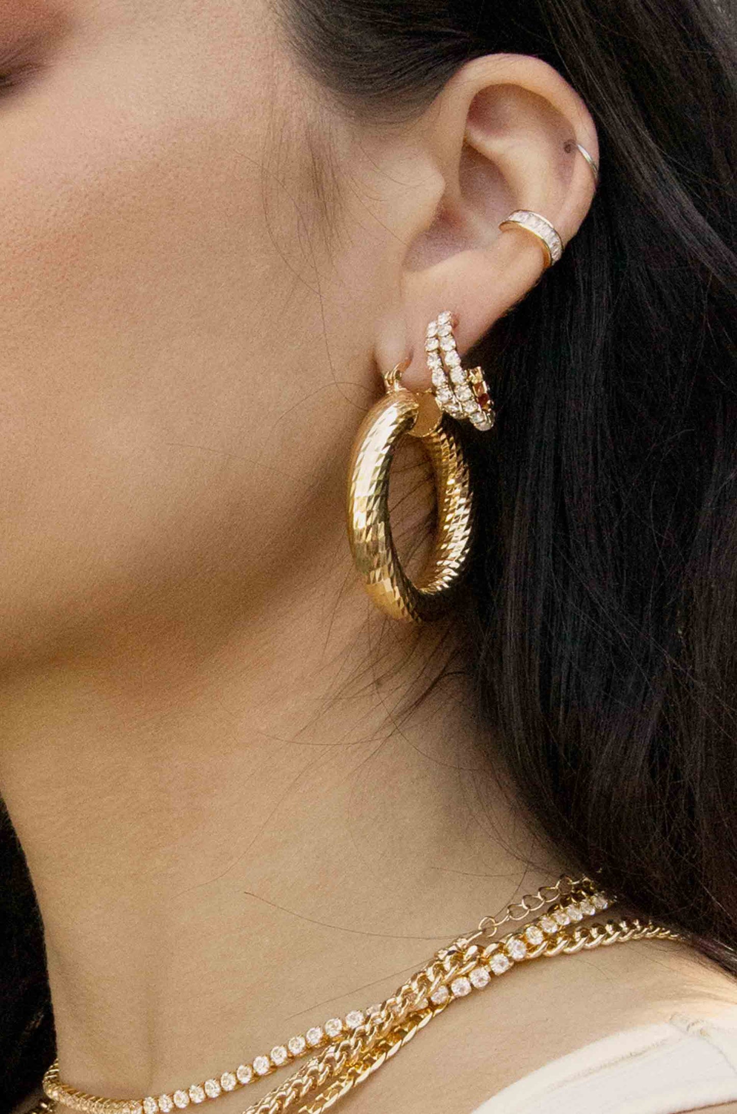 Rhinestone 18k Gold Plated Huggie Hoop Earrings shown on a model  