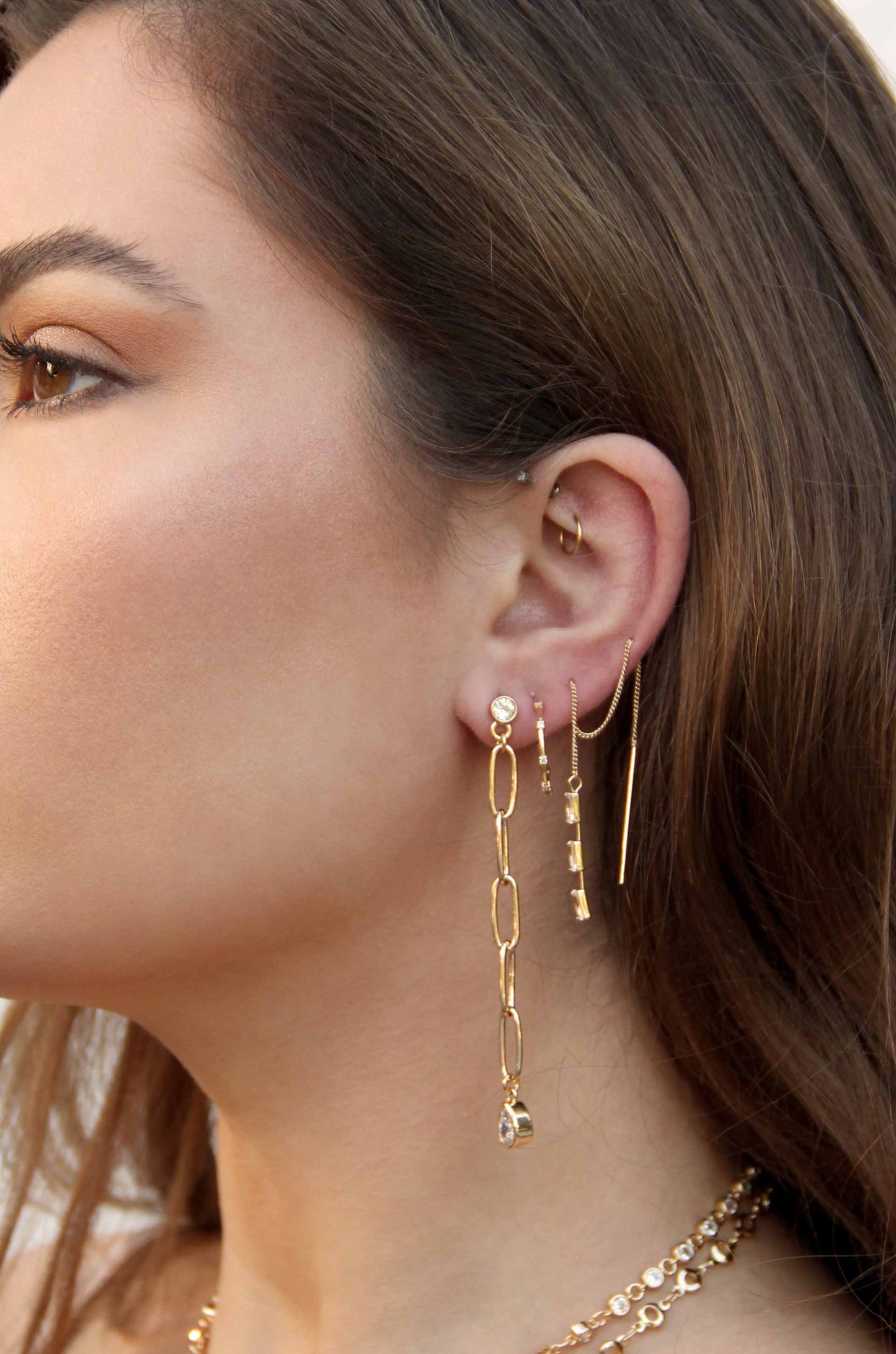 Chain Link Crystal 18k Gold Plated Dangle Earrings shown on a model  