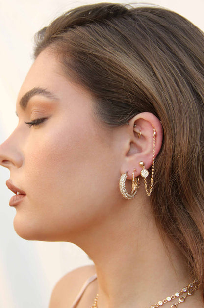 Two Hole Piercing 18k Gold Plated Chain Drop Earrings  shown on a model  