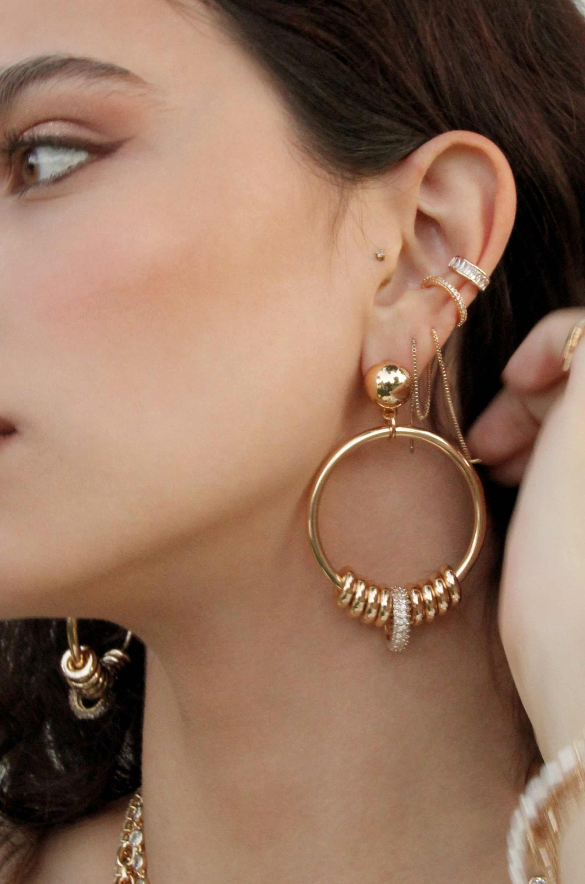 Multi-Ring Slider 18k Gold Plated Earrings shown on a model  