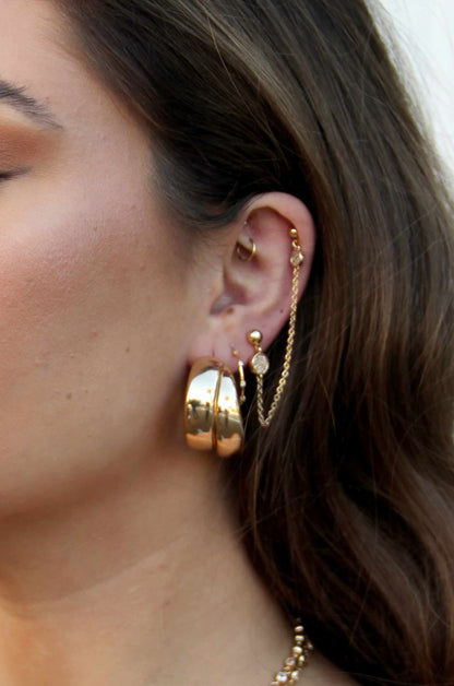 Necessary Accessory 18k Gold Plated Hoop Earrings shown on a model  