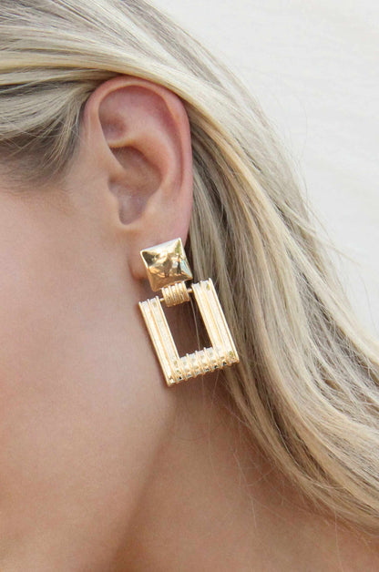 Moving Up Square Dangle 18k Gold Plated Earrings shown on a model  