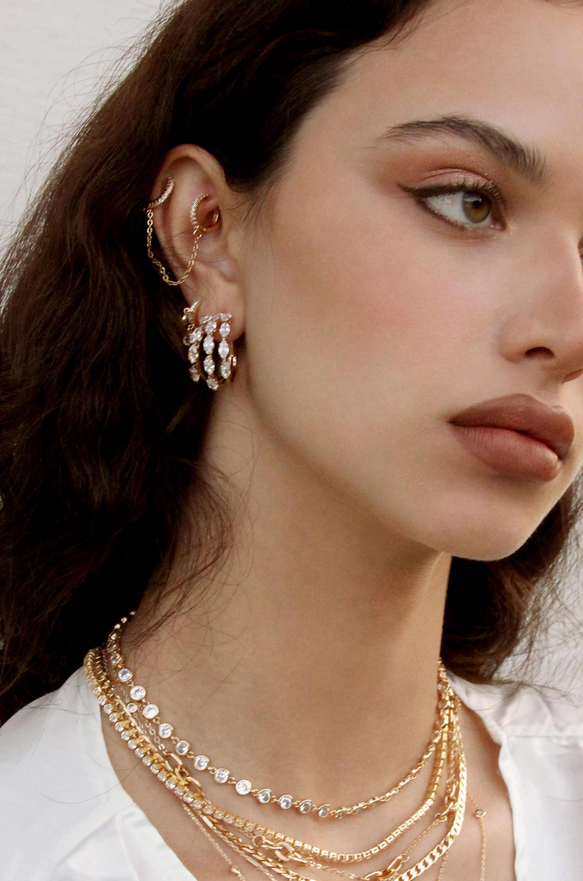 Multi-Crystal Huggie 18k Gold Plated Hoop Earrings shown on a model  