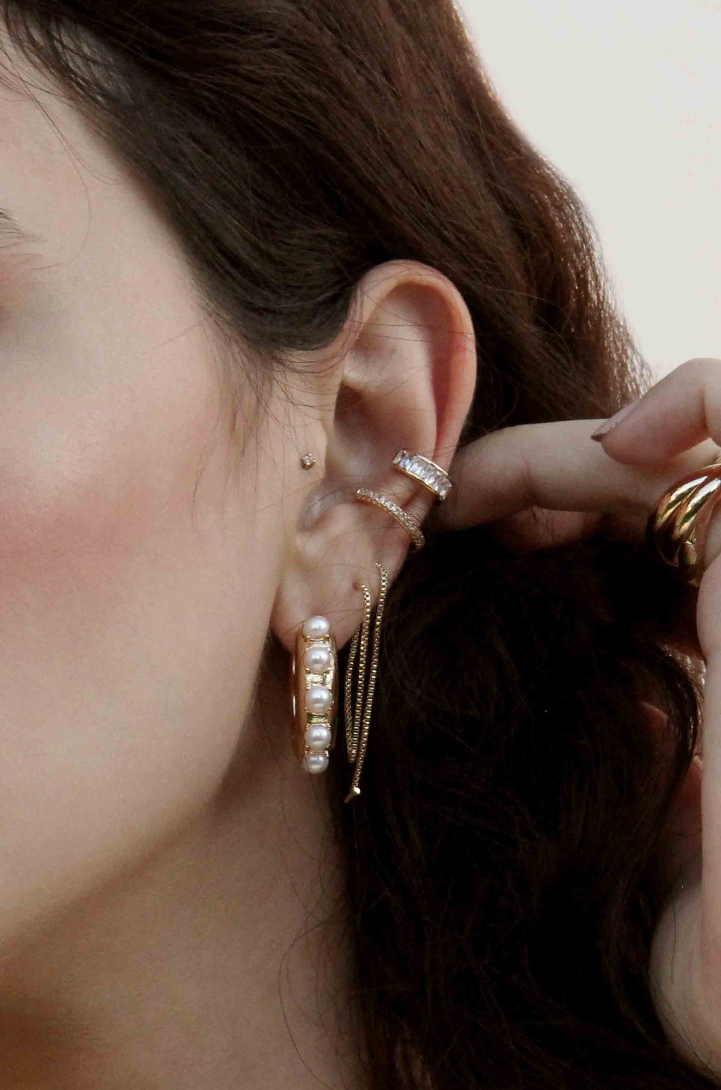 Pearl & 18k Gold Plated Mini Huggie Hoop Earrings shown on a model  