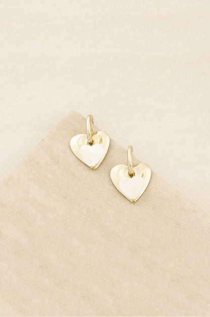 Simple Sweet Mother of Pearl and 18k Gold Plated Heart Earrings on slate background