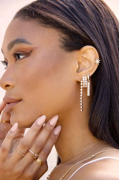 Single File Sparkle 18k Gold Plated Earrings on a model