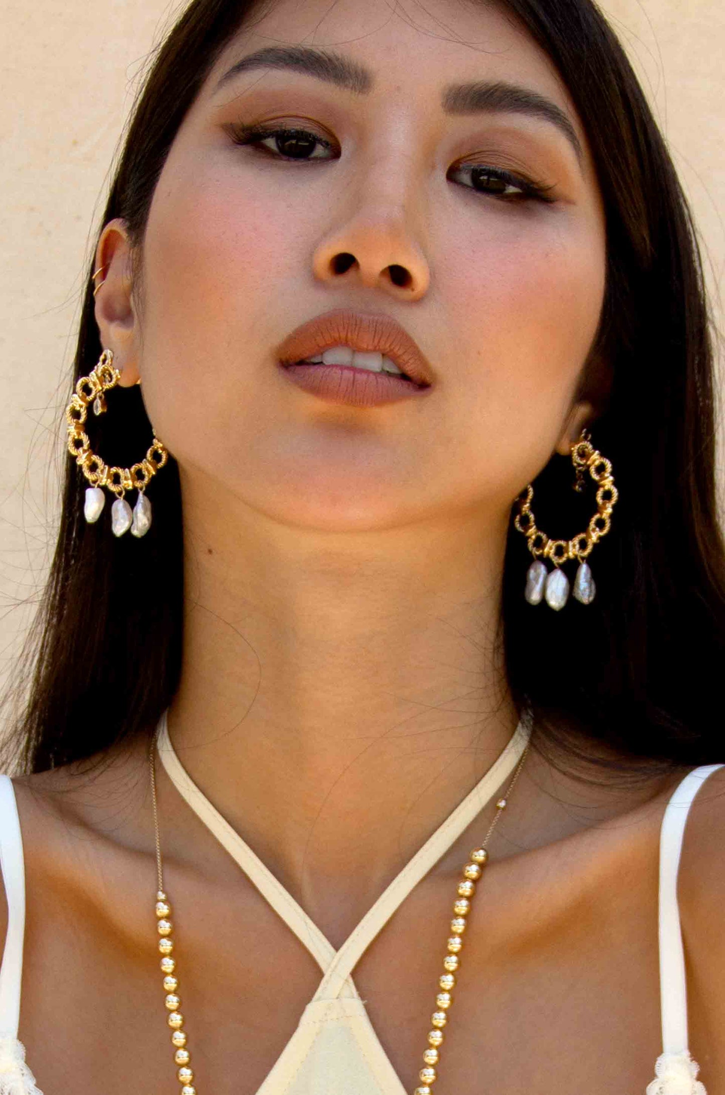 Chunky 18k Gold Plated Hoops with Freshwater Pearl Charms on a model