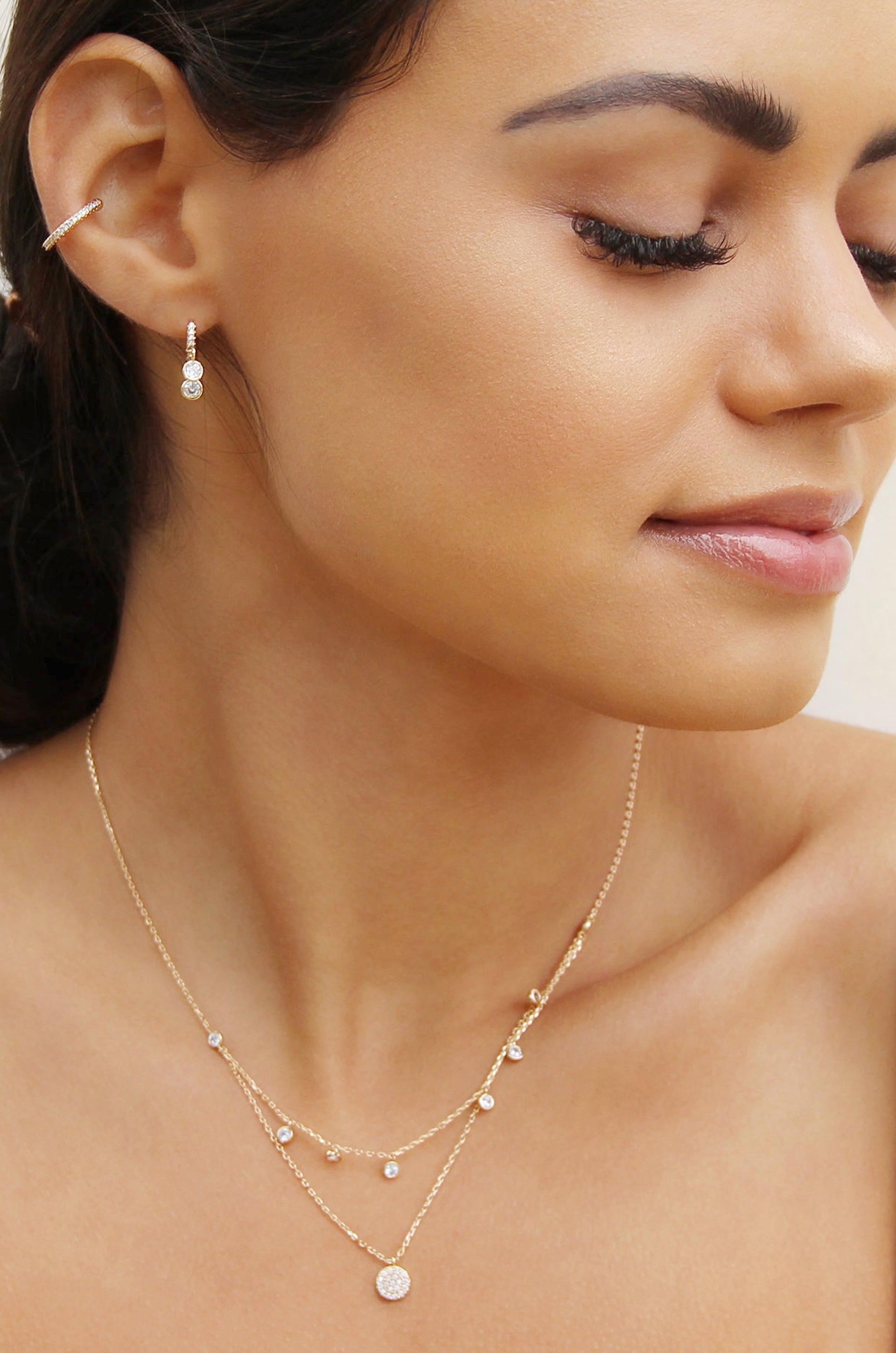 Mini Sparkler Crystal 18k Gold Plated Ear Cuff shown on a model  