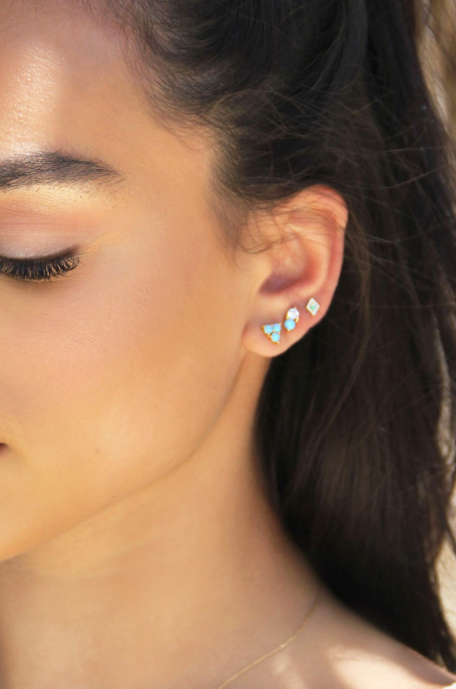 Blue Kyocera Opal & 18k Gold Plated Geometric Stud Set shown on a model  