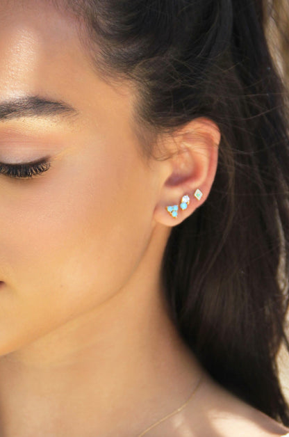 Blue Kyocera Opal & 18k Gold Plated Geometric Stud Set shown on a model  