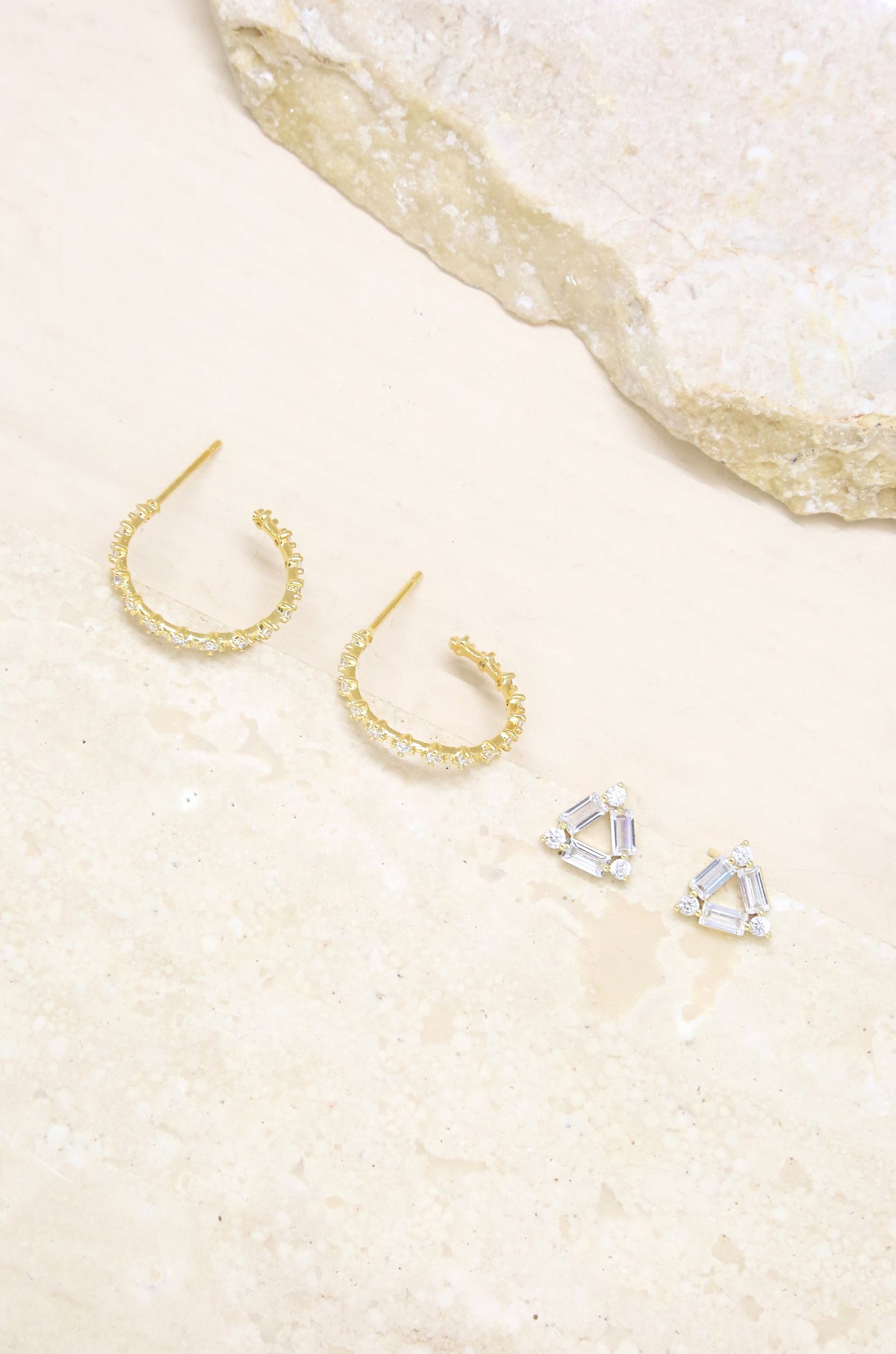 Triangle Crystal Stud & 18k Gold Plated Hoop Earring Set on slate background  