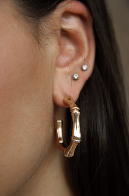 Golden Reign Hoop Earring Set shown on a model  