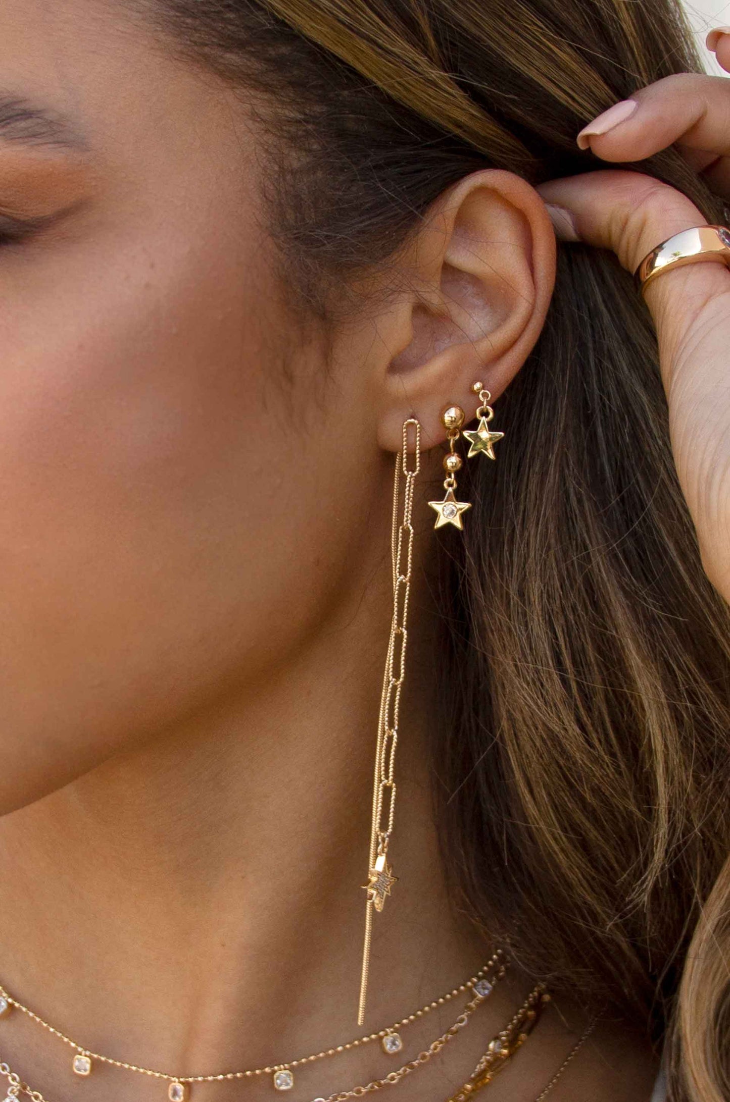 Constellation Star Dangle Earring Set of 4 in Gold on a model
