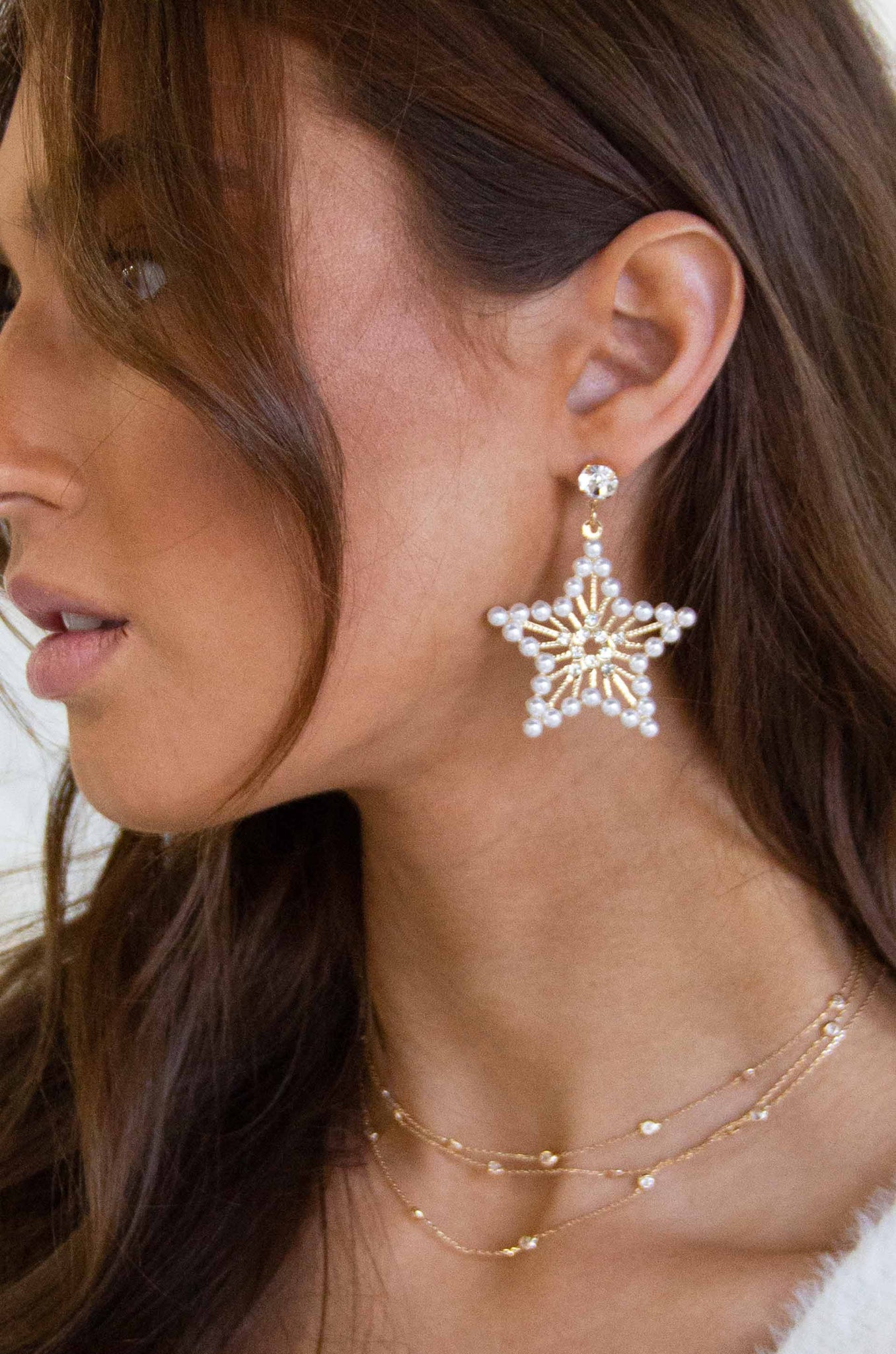 Star Power Pearl and 18k Gold Plated Earrings on a model