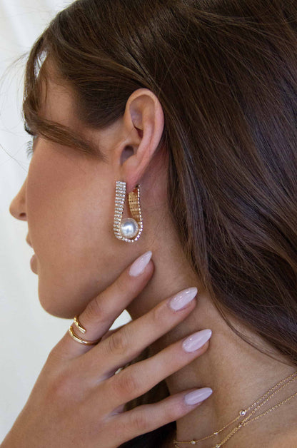 Swaddled Pearl Crystal Teardrop 18k Gold Plated Earrings on a model