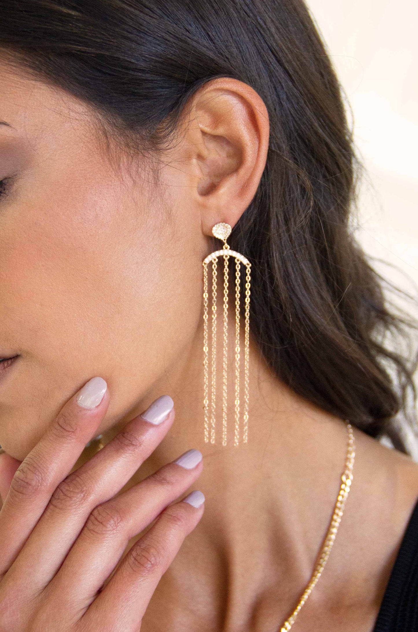In the Spotlight Crystal Dangle 18k Gold Plated Earrings on a model