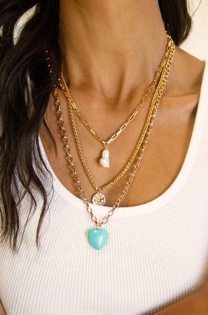 The Malibu Turquoise, Coin, and Pearl 18k Gold Plated Necklace Set on a model