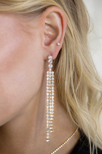 The Moment 18k Gold Plated Crystal Dangle Earrings on a model
