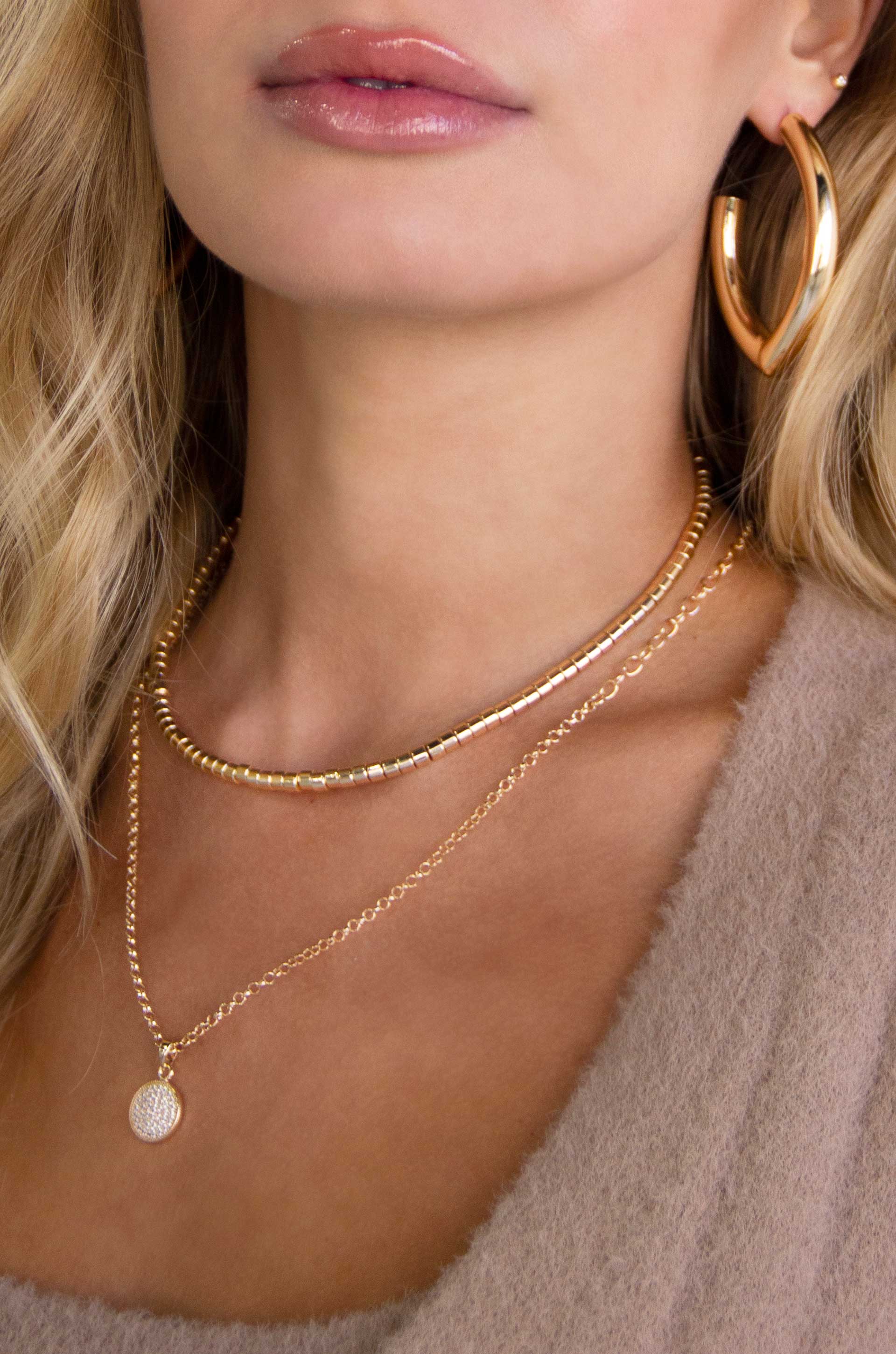 Mara Elongated 18k Gold Plated Hoop Earrings on a model
