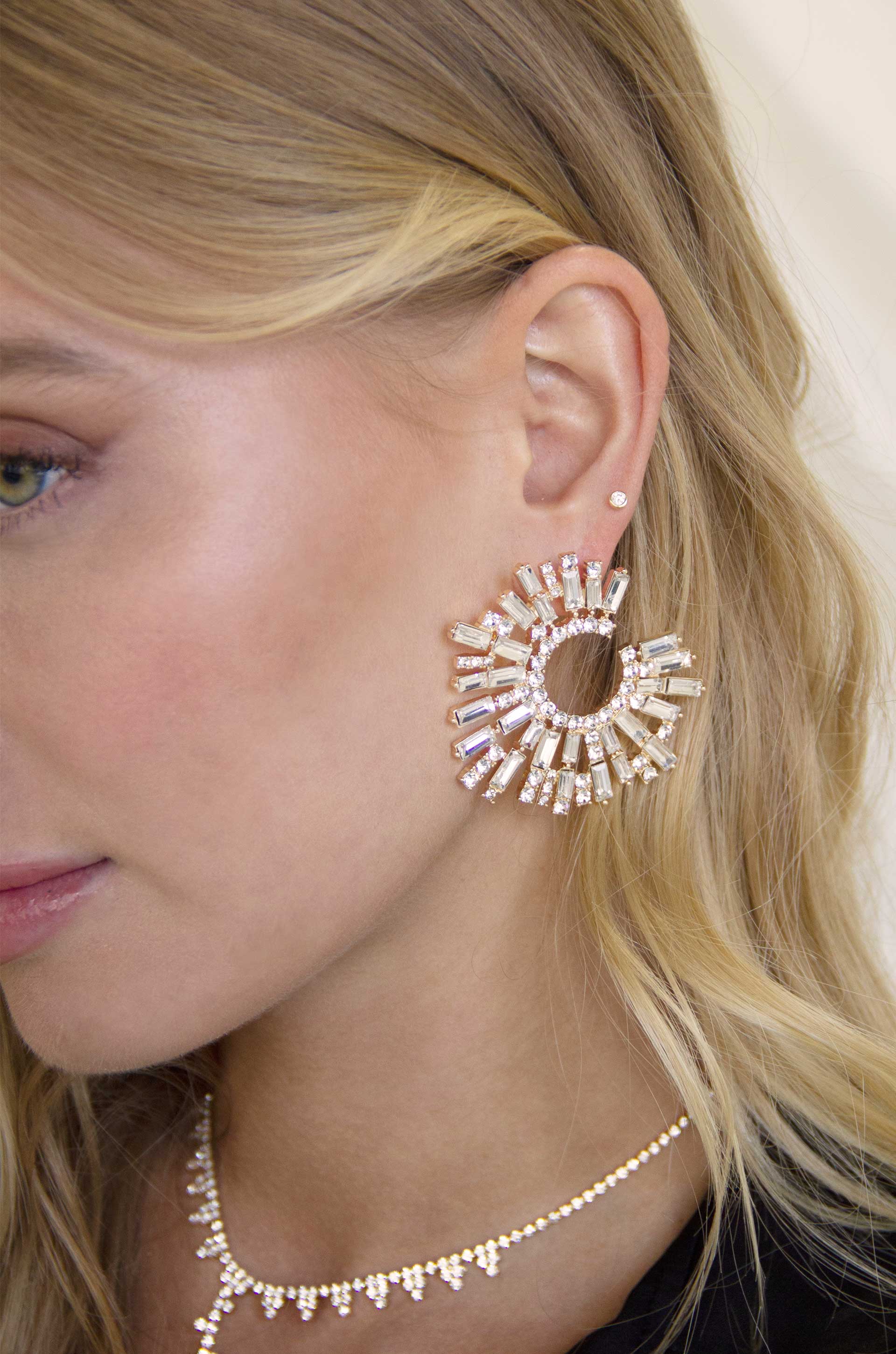 Opulent Crystal Stardust 18k Gold Plated Open Circle Earrings on a model