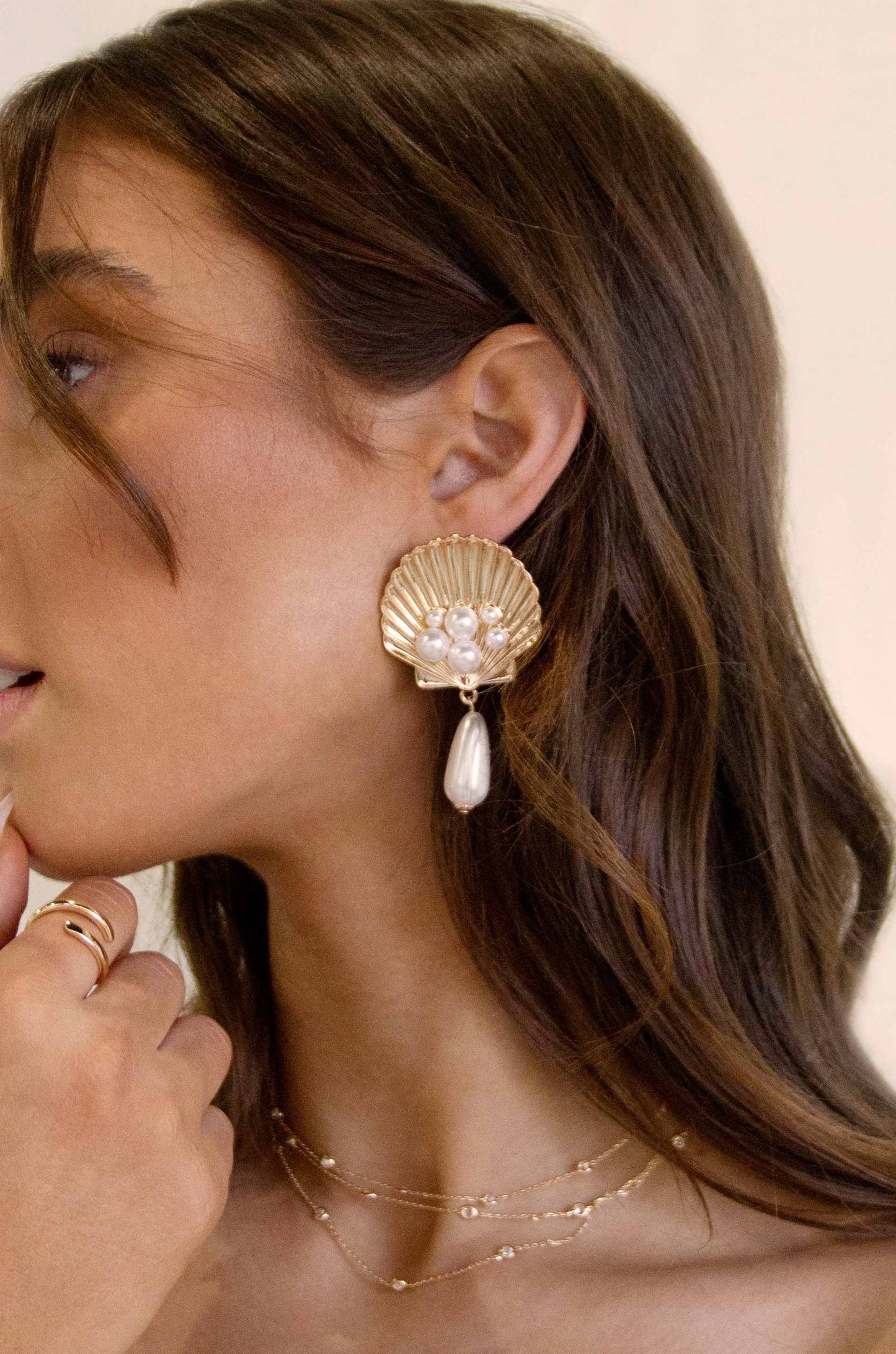Golden Seashell Pearl Drop 18k Gold Plated Earrings on a model
