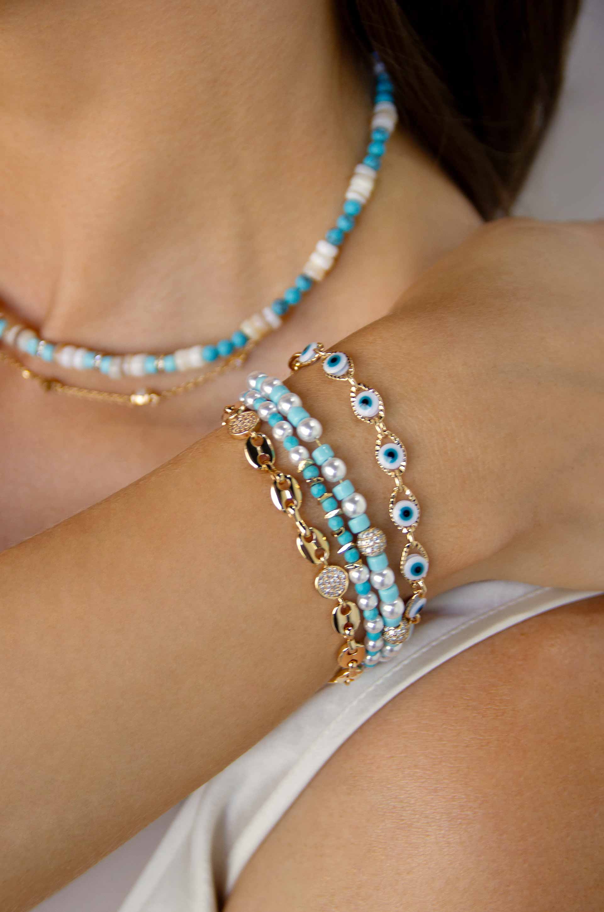 Turquoise and Pearl Protection Spell 18k Gold Plated Bracelet Set on a model
