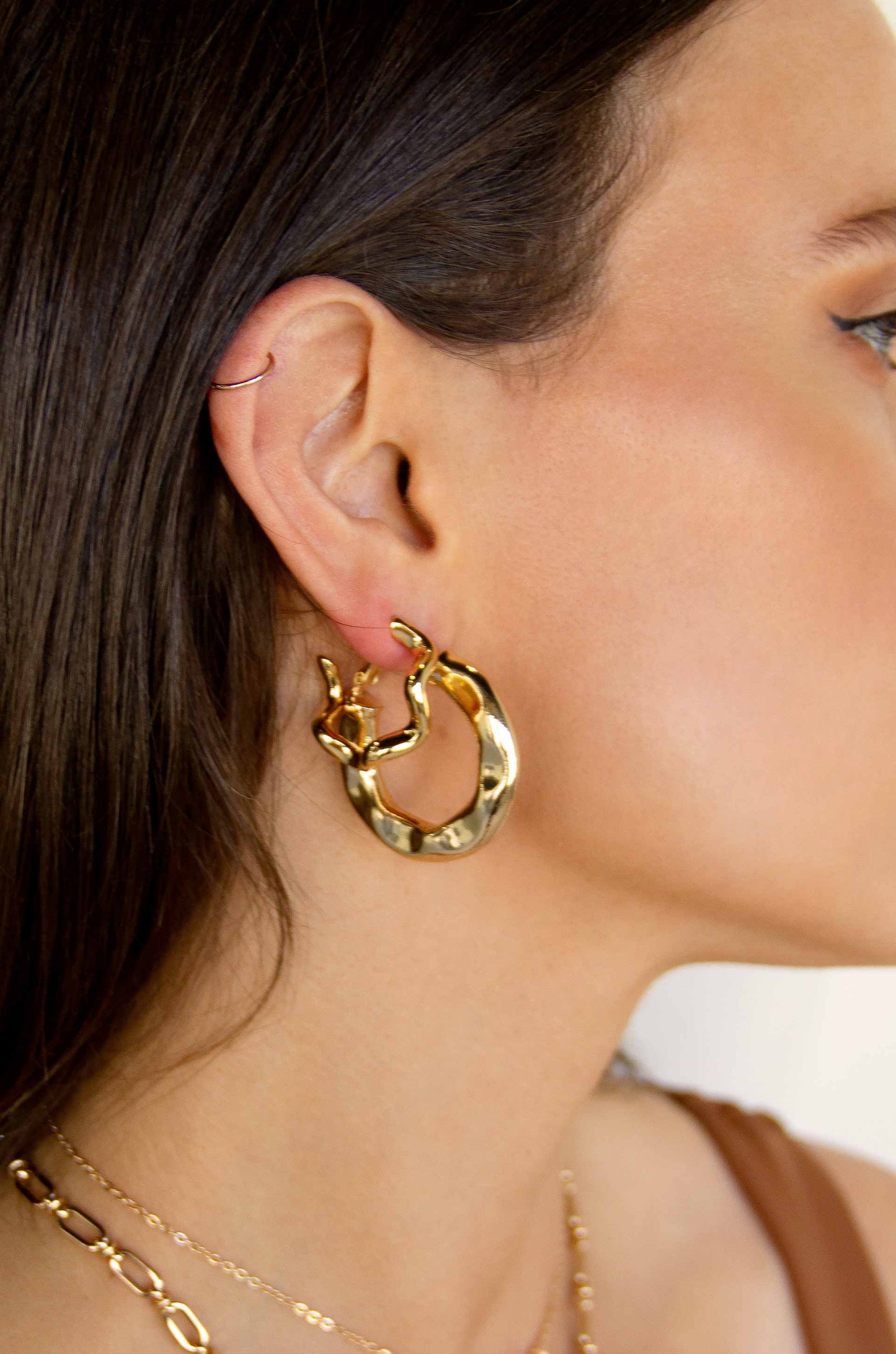 Soft Golden Textured 18k Gold Plated Hoop Earrings on a model
