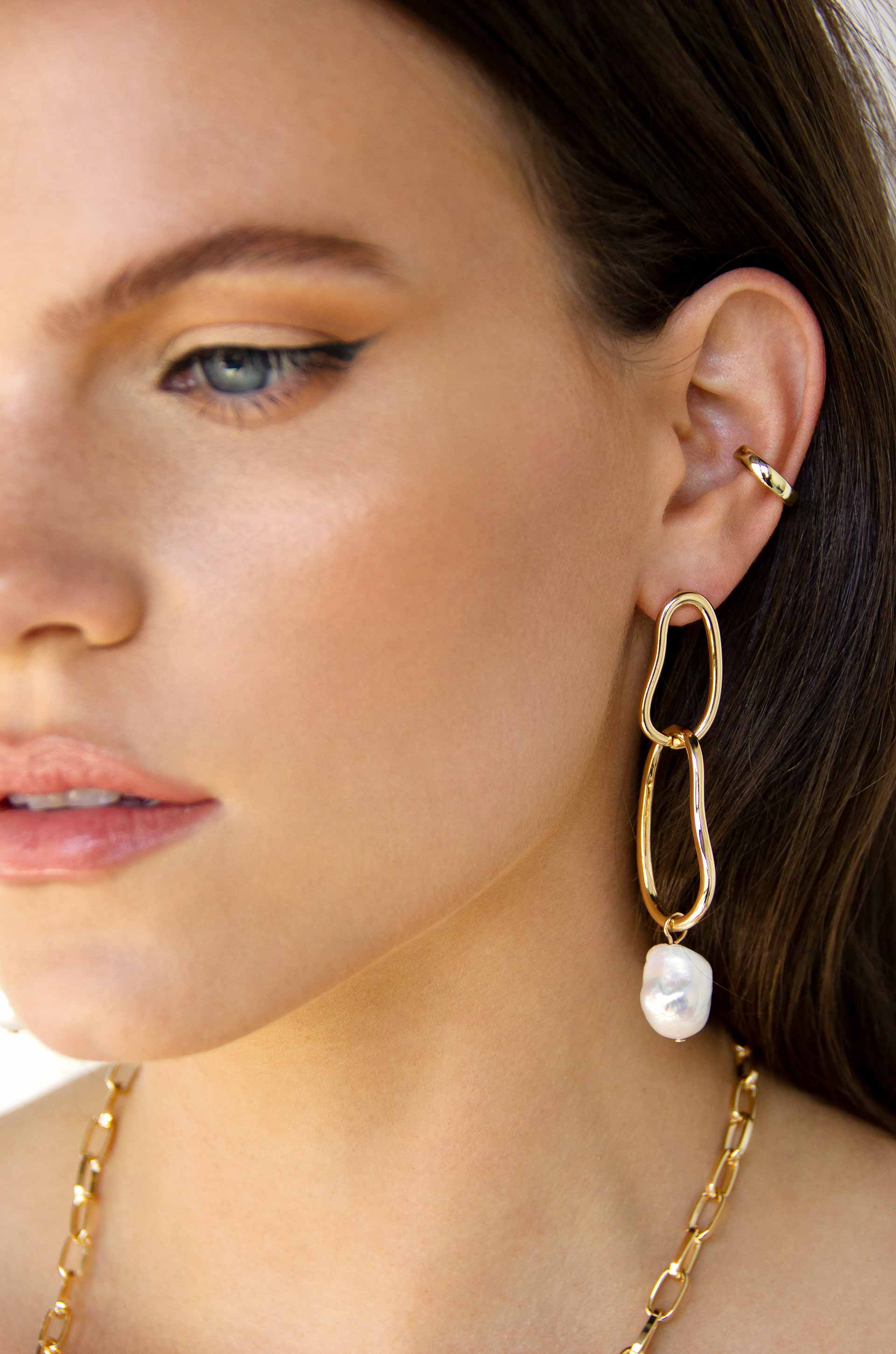 Mara Dangle Pearl 18k Gold Plated Earrings on a model