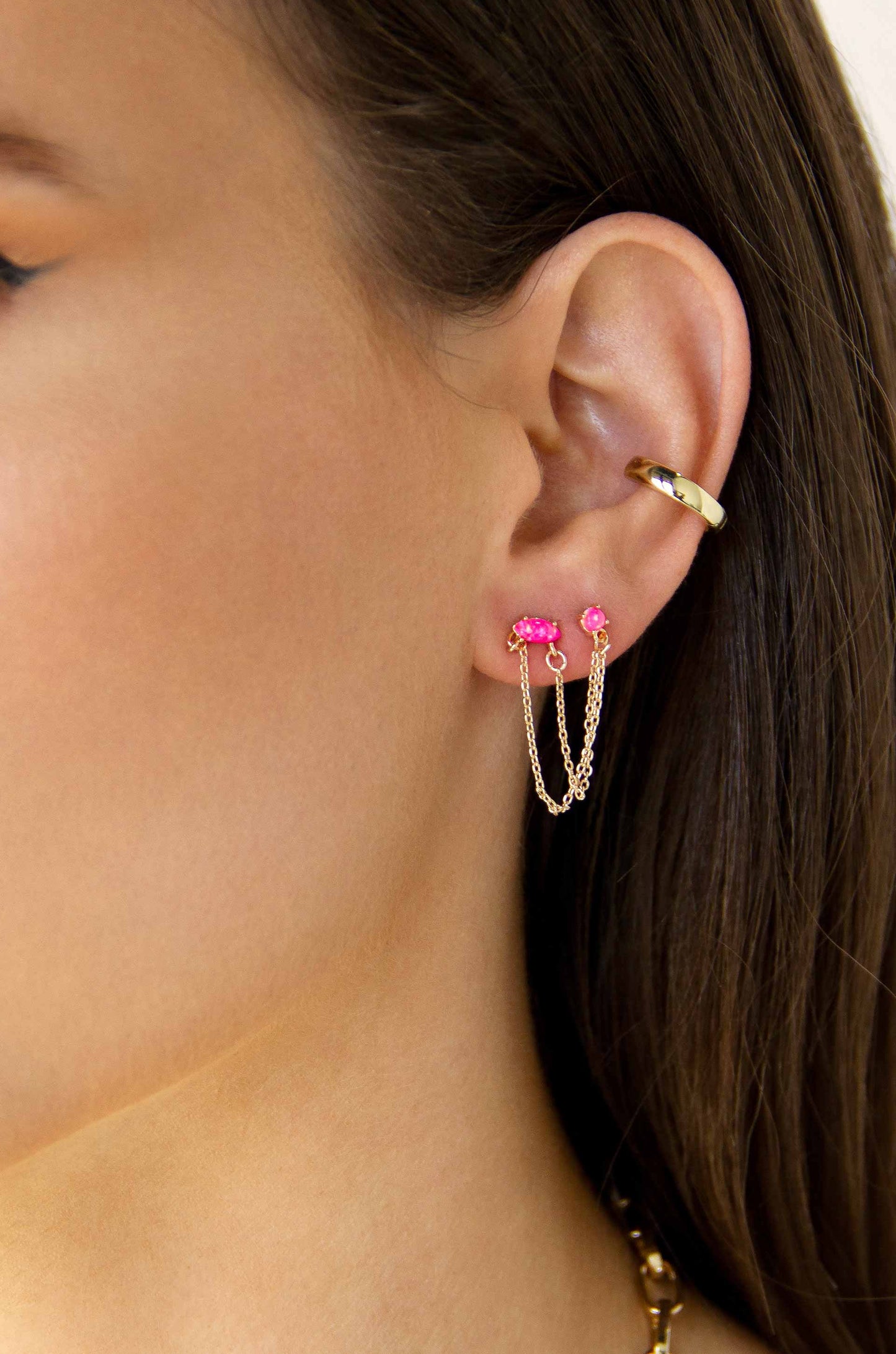Two Hole Piercing Chain Dangle Earrings in pink crystals on a model