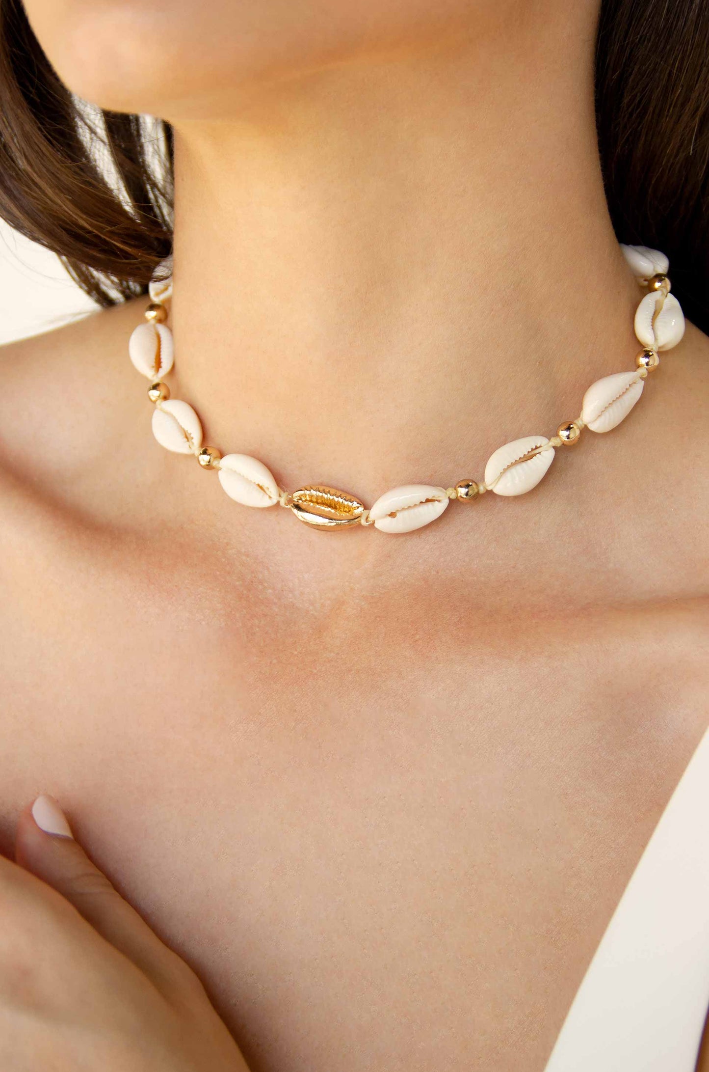 Out to Sea Cowrie Shell & 18kt Gold Plated Necklace on a model