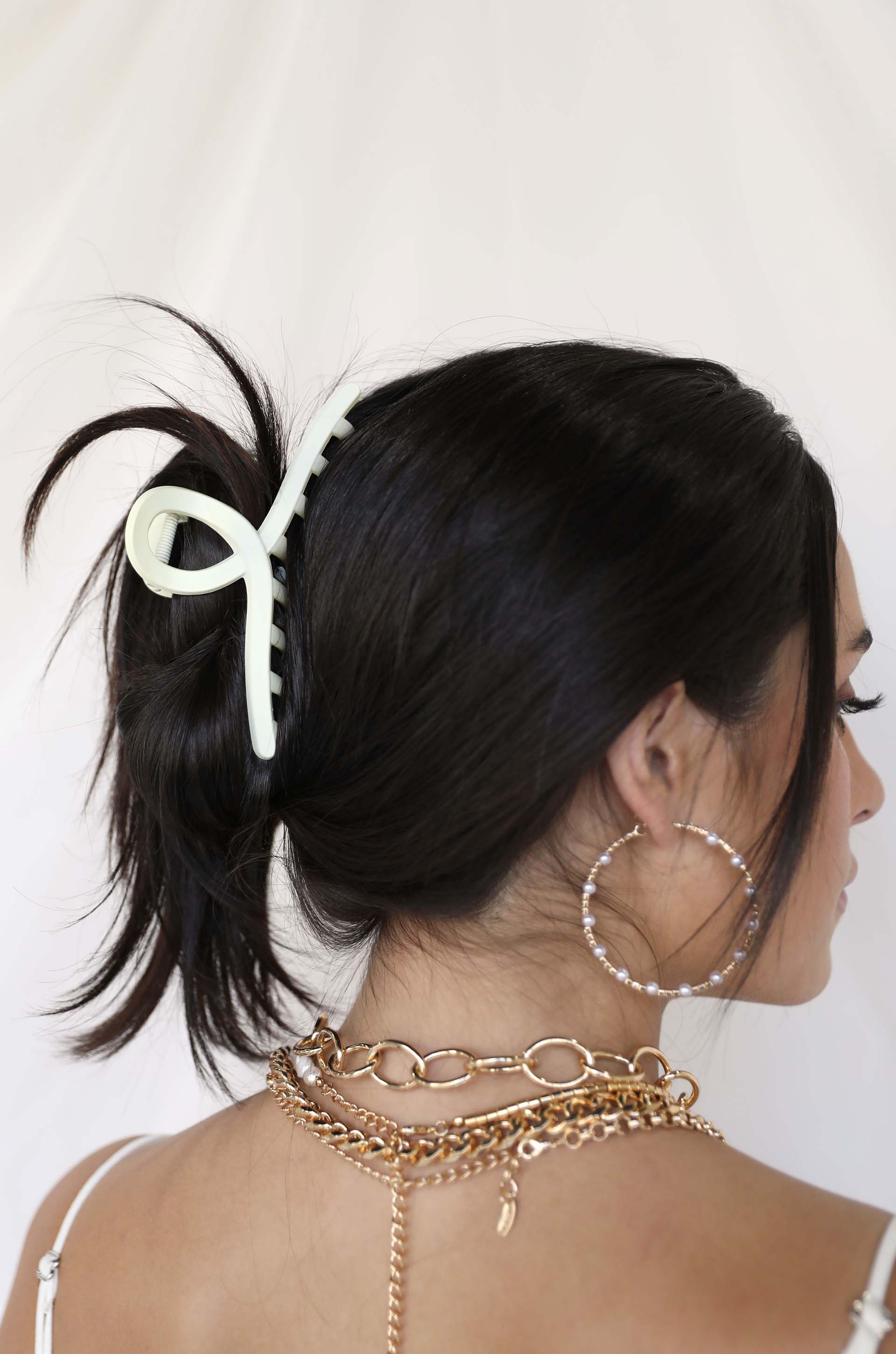 A Mermaid's Pearl and Crystal Dotted Hoop Earrings on model
