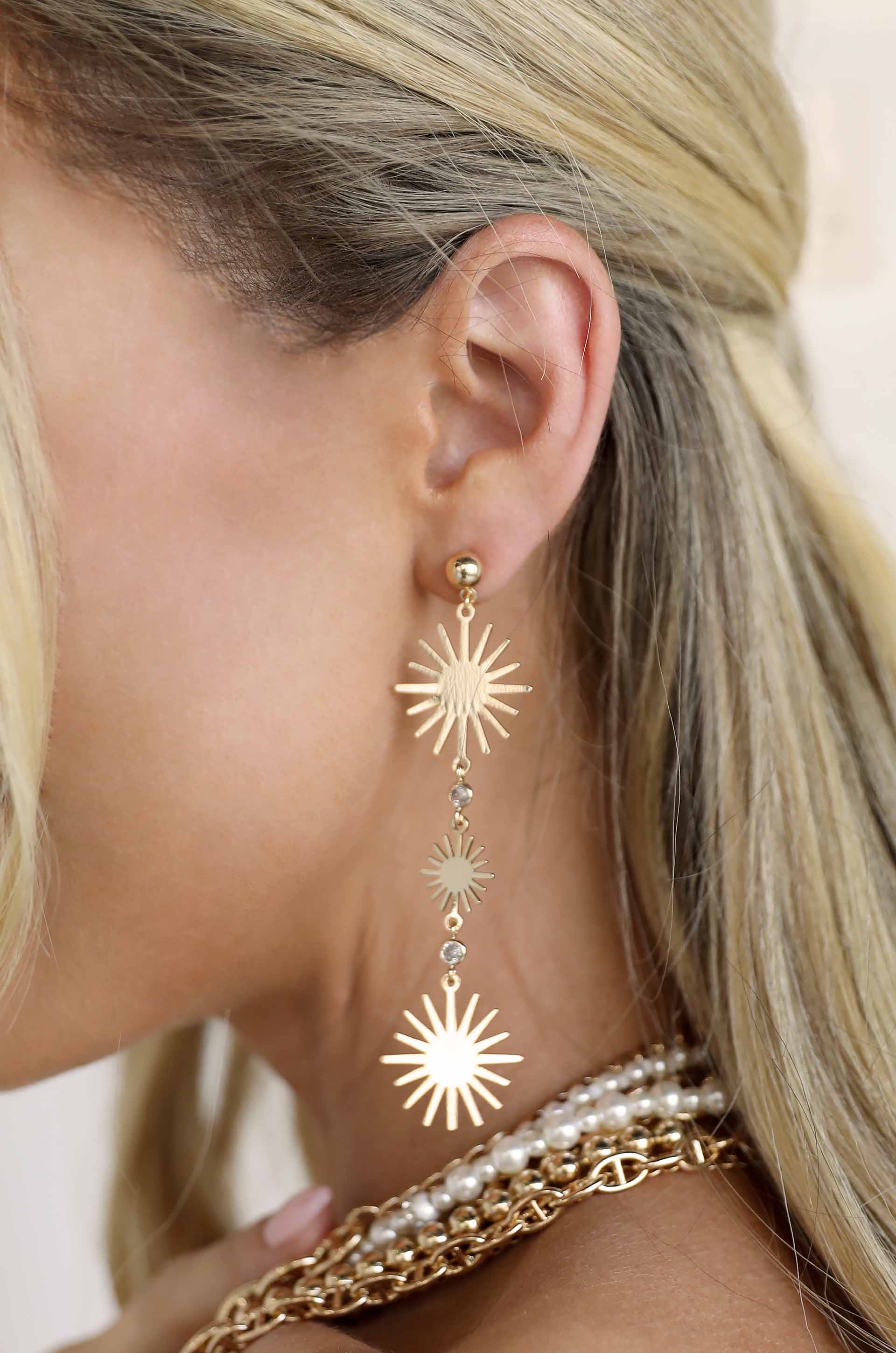 Sunburst Drop 18k Gold Plated Dangle Earrings on a model