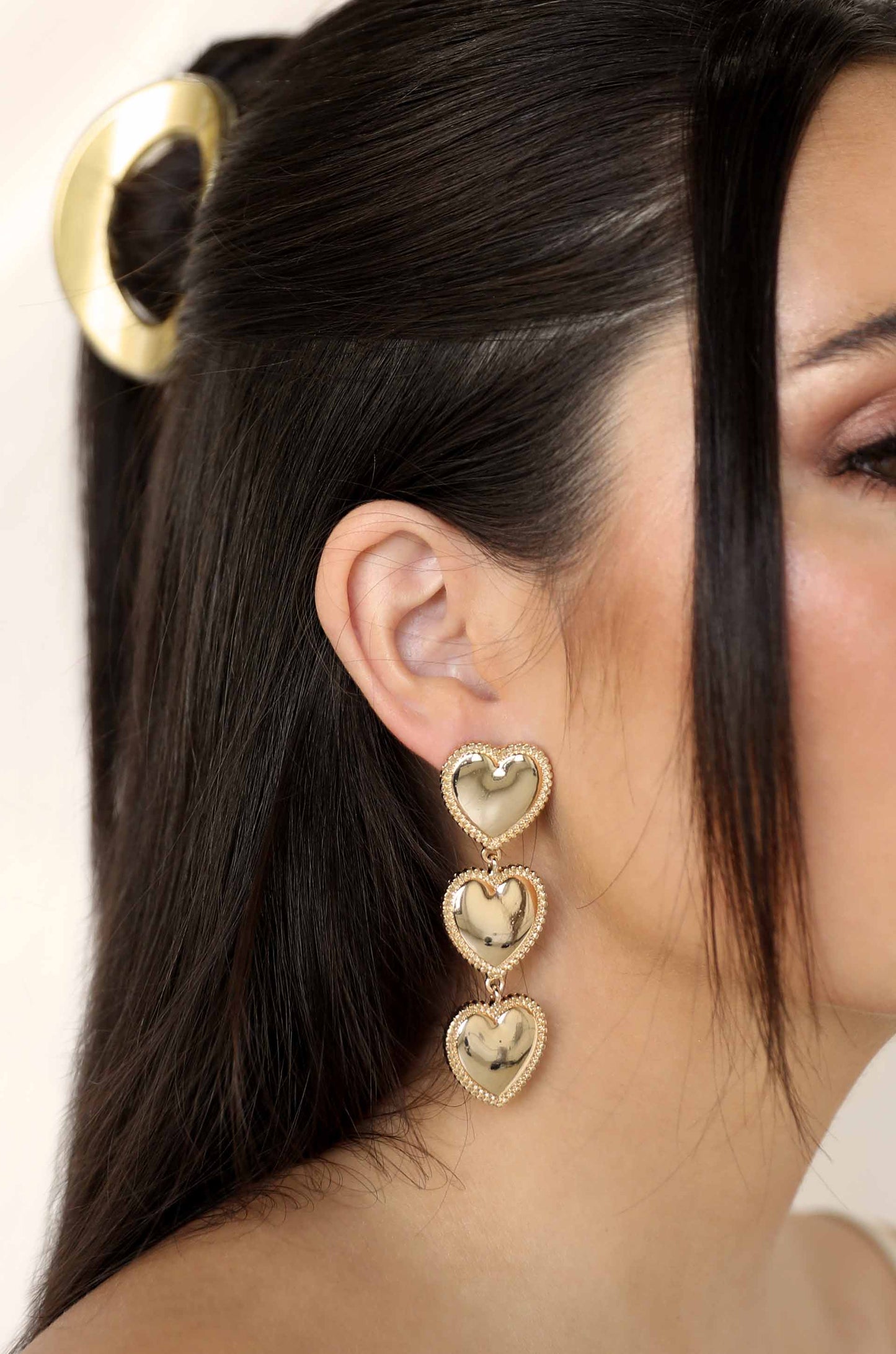 Golden Love Drop 18k Gold Plated Dangle Earrings on a model