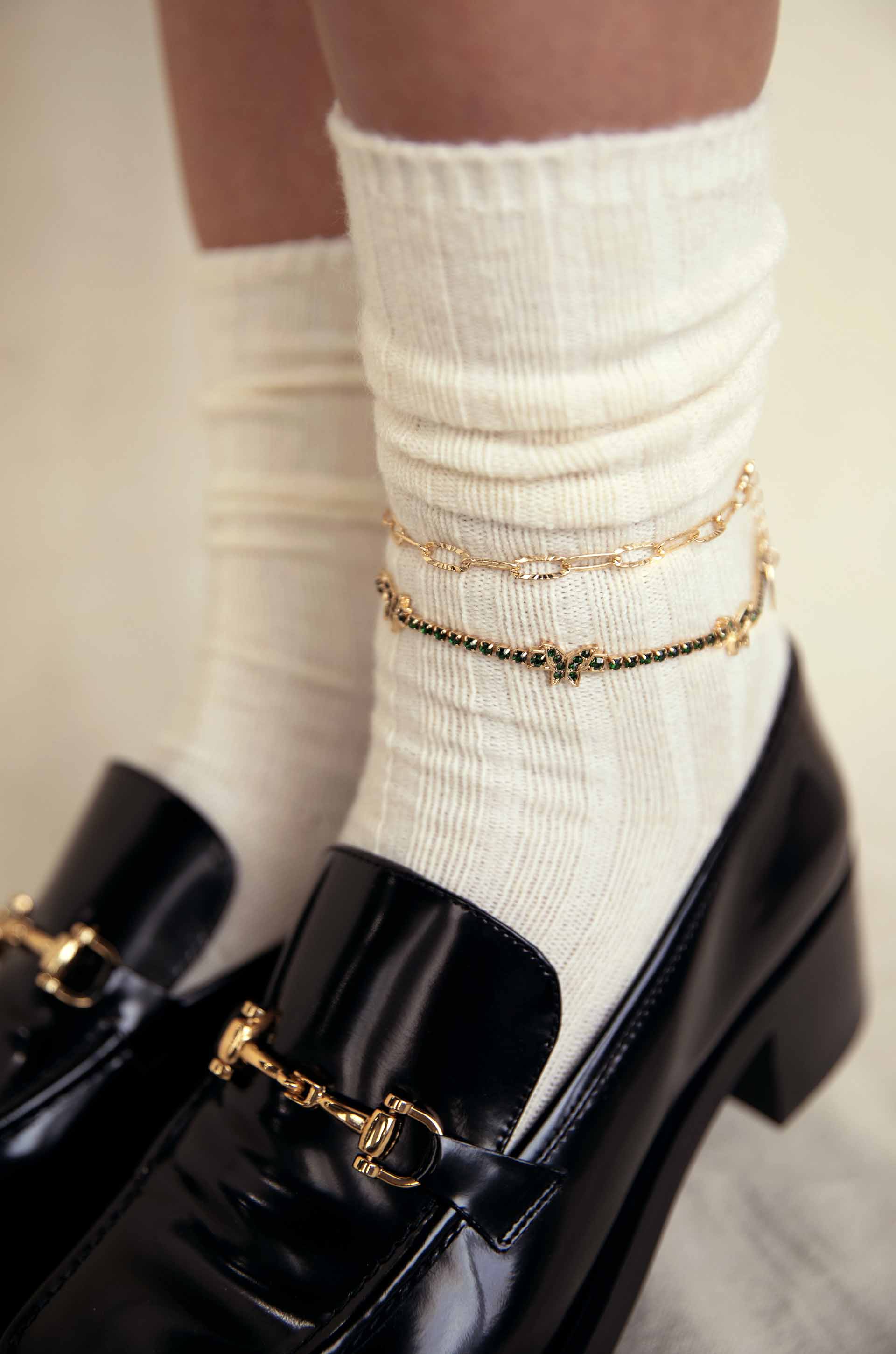 Butterfly High 18k Gold Plated Anklet Set on a model with socks