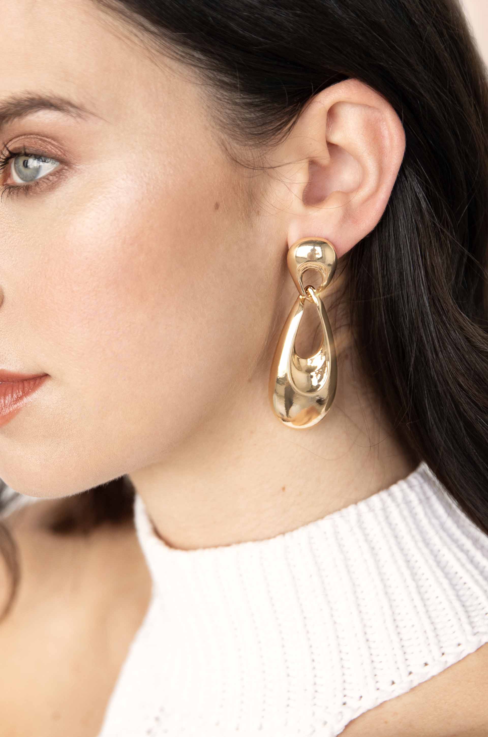 Infinity 18k Gold Plated Earrings on a model