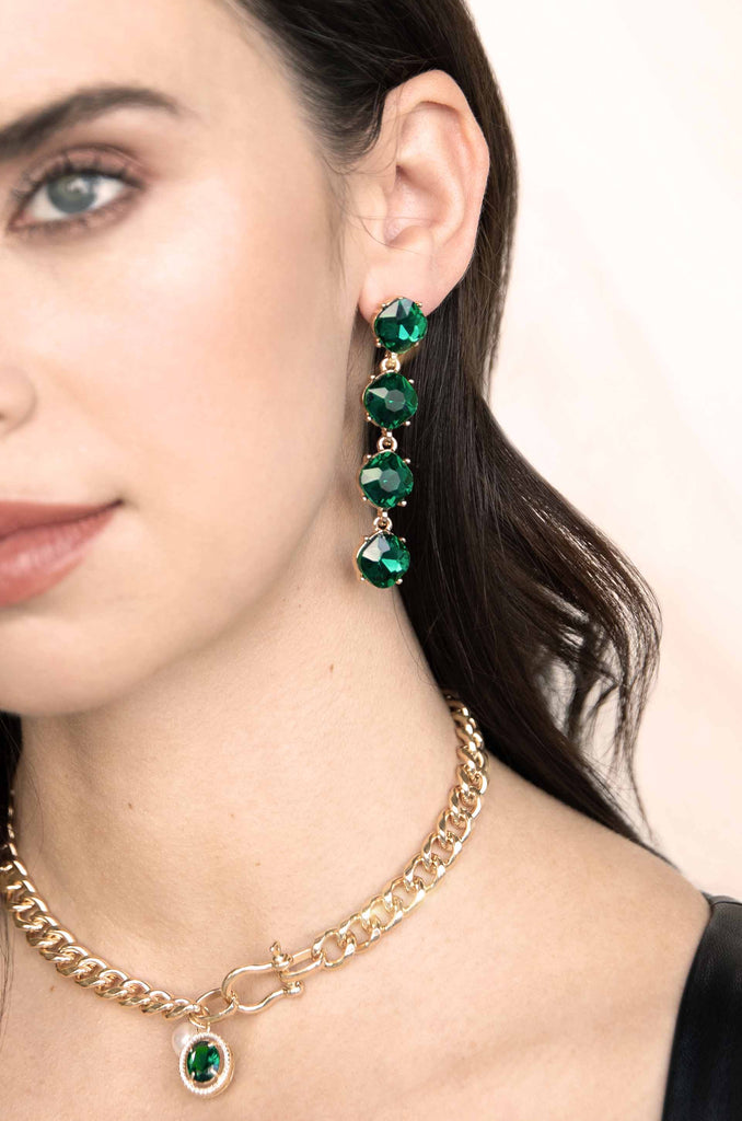 Four the Money 18k Gold Plated Earrings on a model